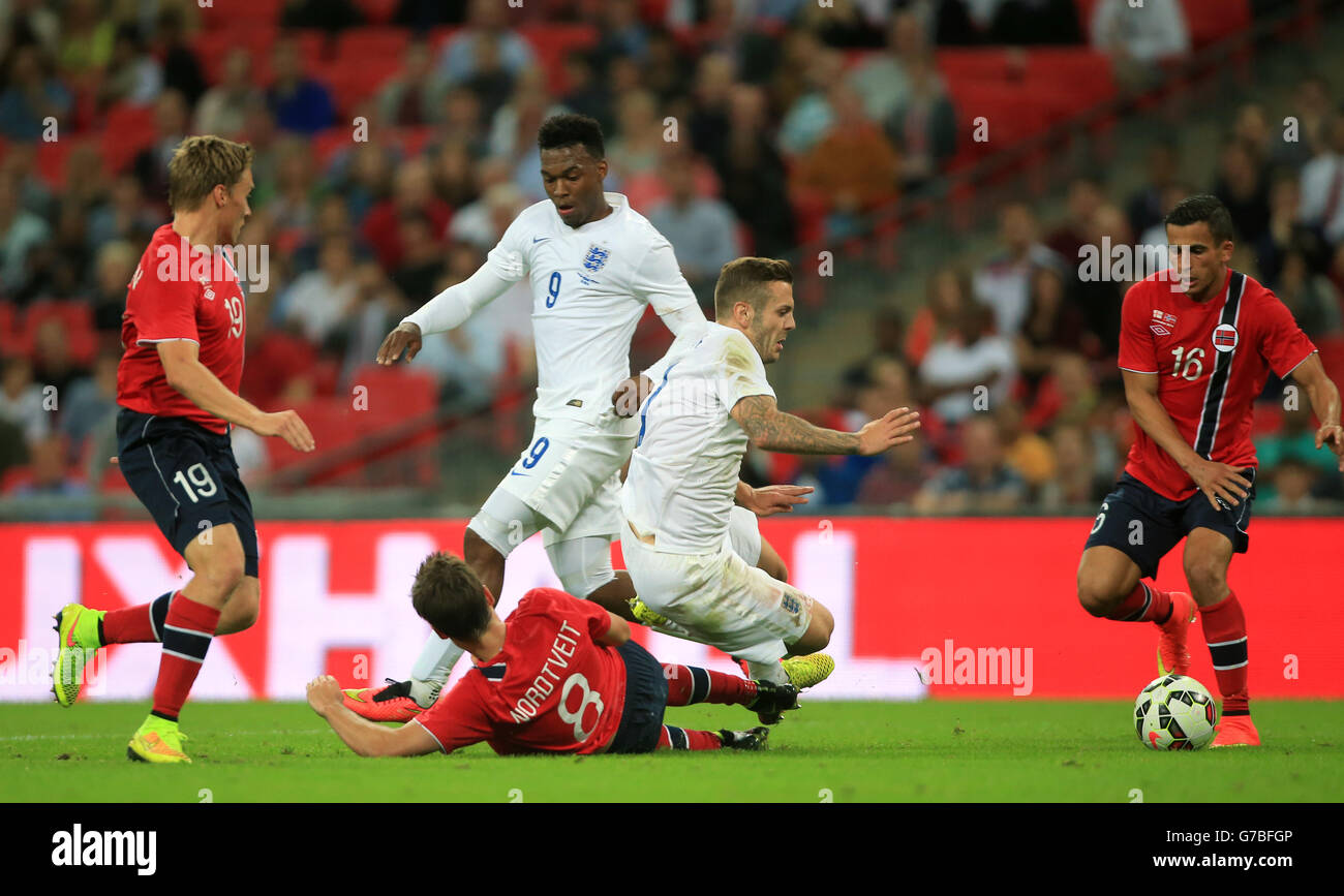 England's Jack Wilshere goes down under the tackle of Norway's Havard Nordtveit in the penalty area but no penalty is given during the International Friendly at Wembley Stadium, London. PRESS ASSOCIATION Photo. Picture date: Wednesday September 3, 2014. See PA story SOCCER England. Photo credit should read: Nick Potts/PA Wire. Stock Photo