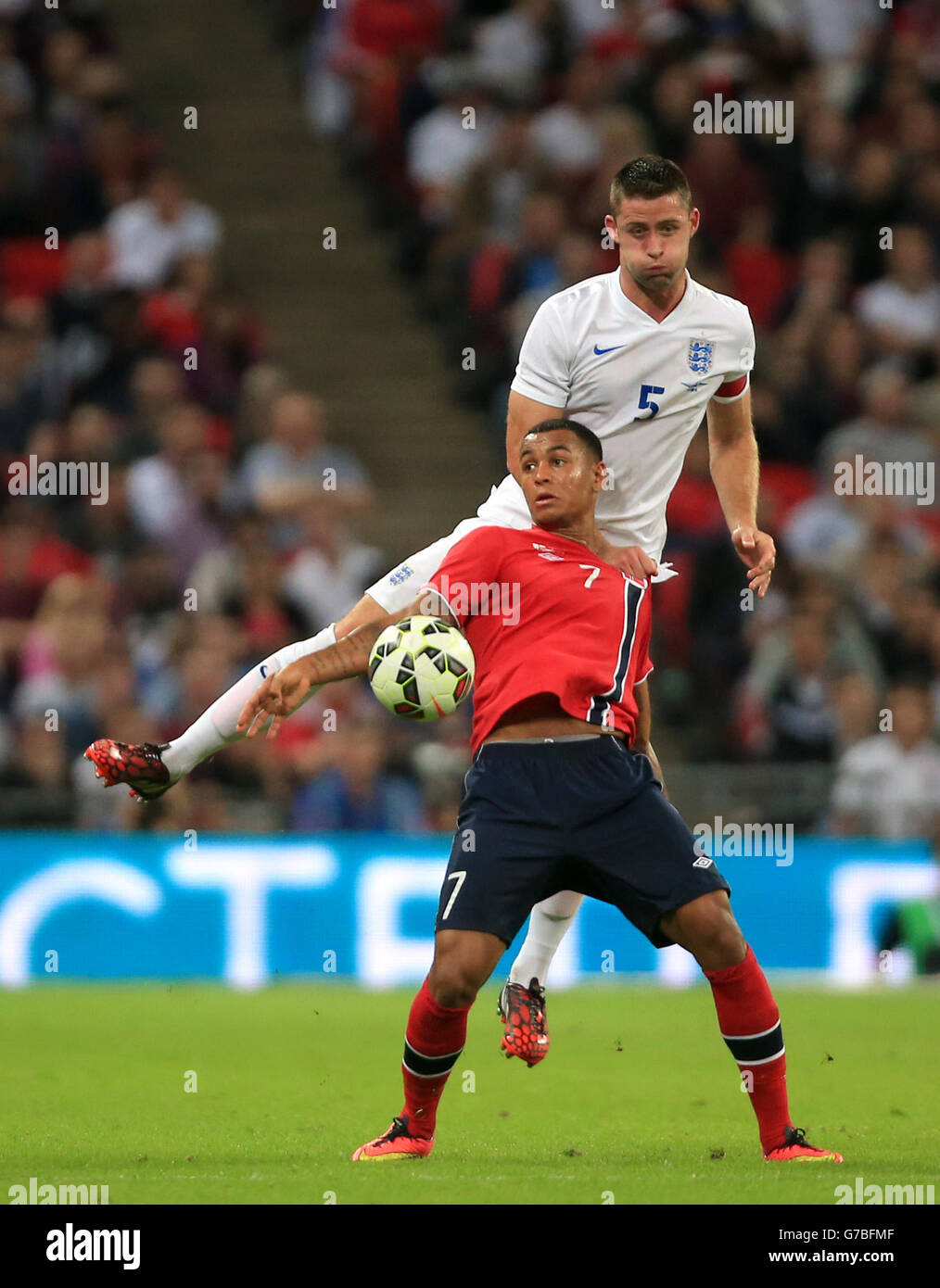 England's Gary Cahill (top) and Norway's Joshua King (bottom) battle for the ball in the air during the International Friendly at Wembley Stadium, London. PRESS ASSOCIATION Photo. Picture date: Wednesday September 3, 2014. See PA story SOCCER England. Photo credit should read: Nick Potts/PA Wire. Stock Photo