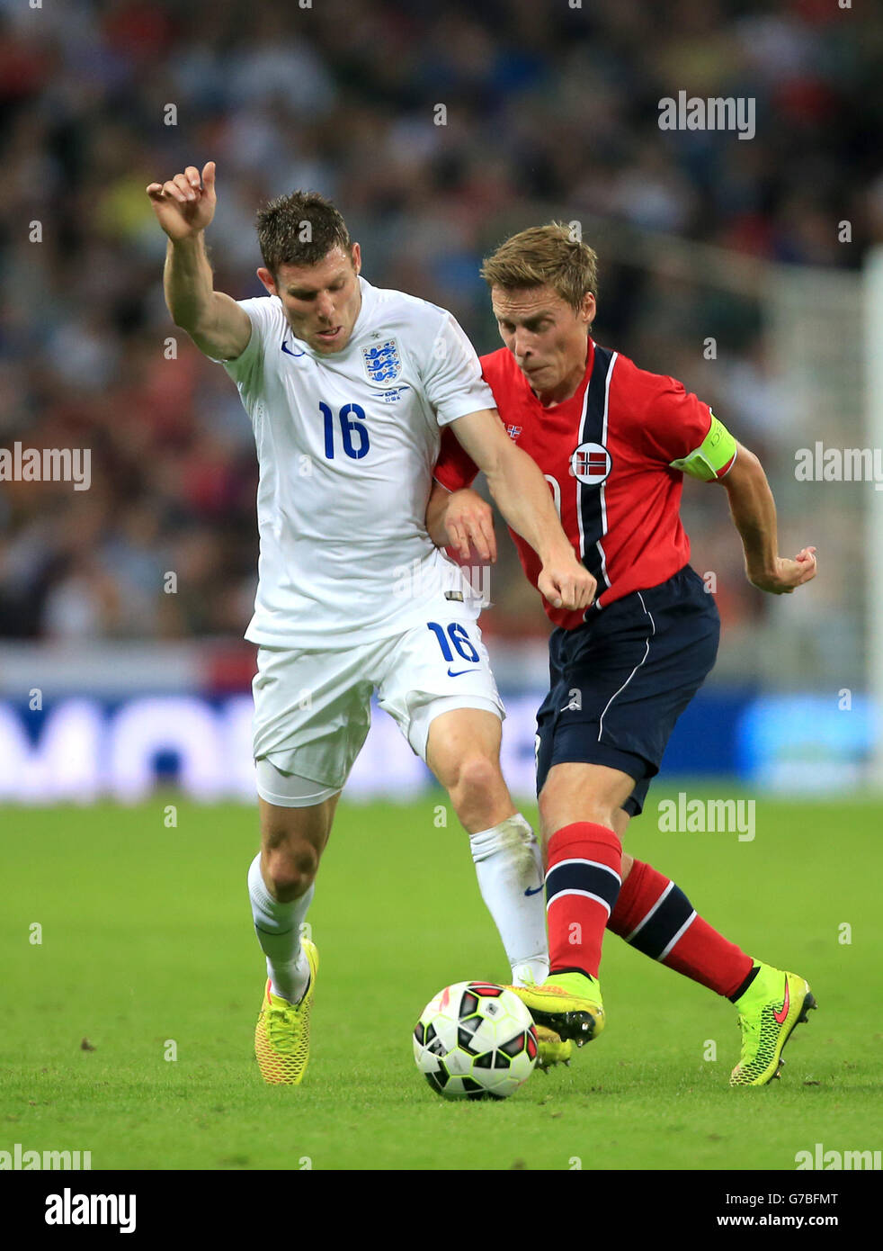 England's James Milner (left) and Norway's Per Skjelbred (right) battle for the ball during the International Friendly at Wembley Stadium, London. PRESS ASSOCIATION Photo. Picture date: Wednesday September 3, 2014. See PA story SOCCER England. Photo credit should read: Nick Potts/PA Wire. Stock Photo