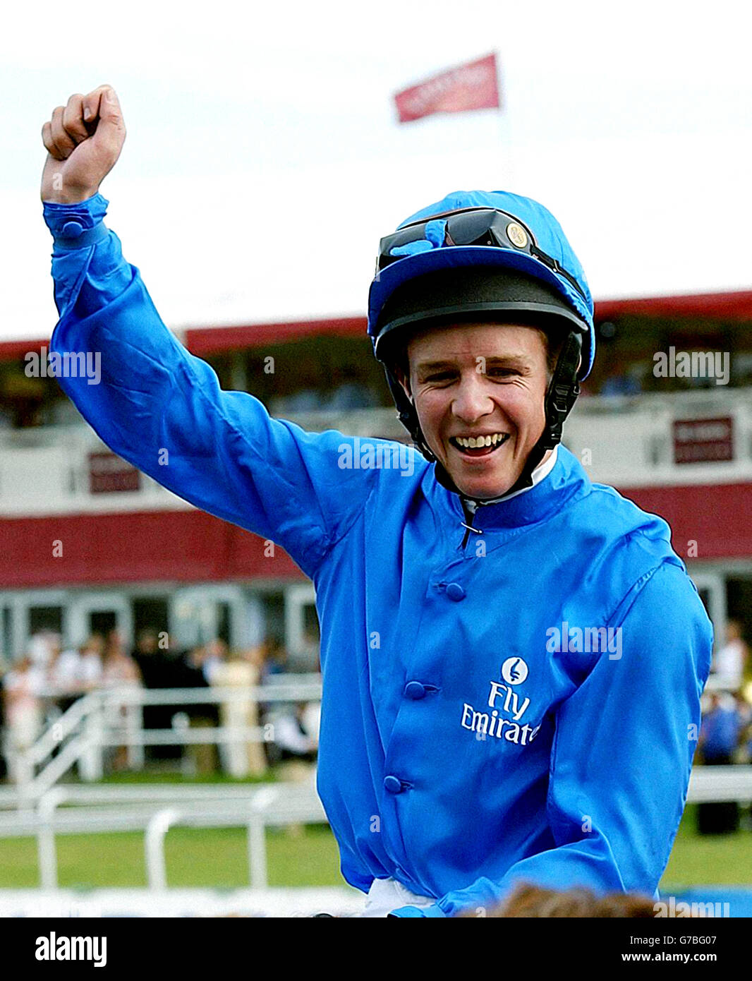Australian jockey Kerrin McEvoy is led in after his victory in the St Leger on Rule of Law at Doncaster Races. Stock Photo