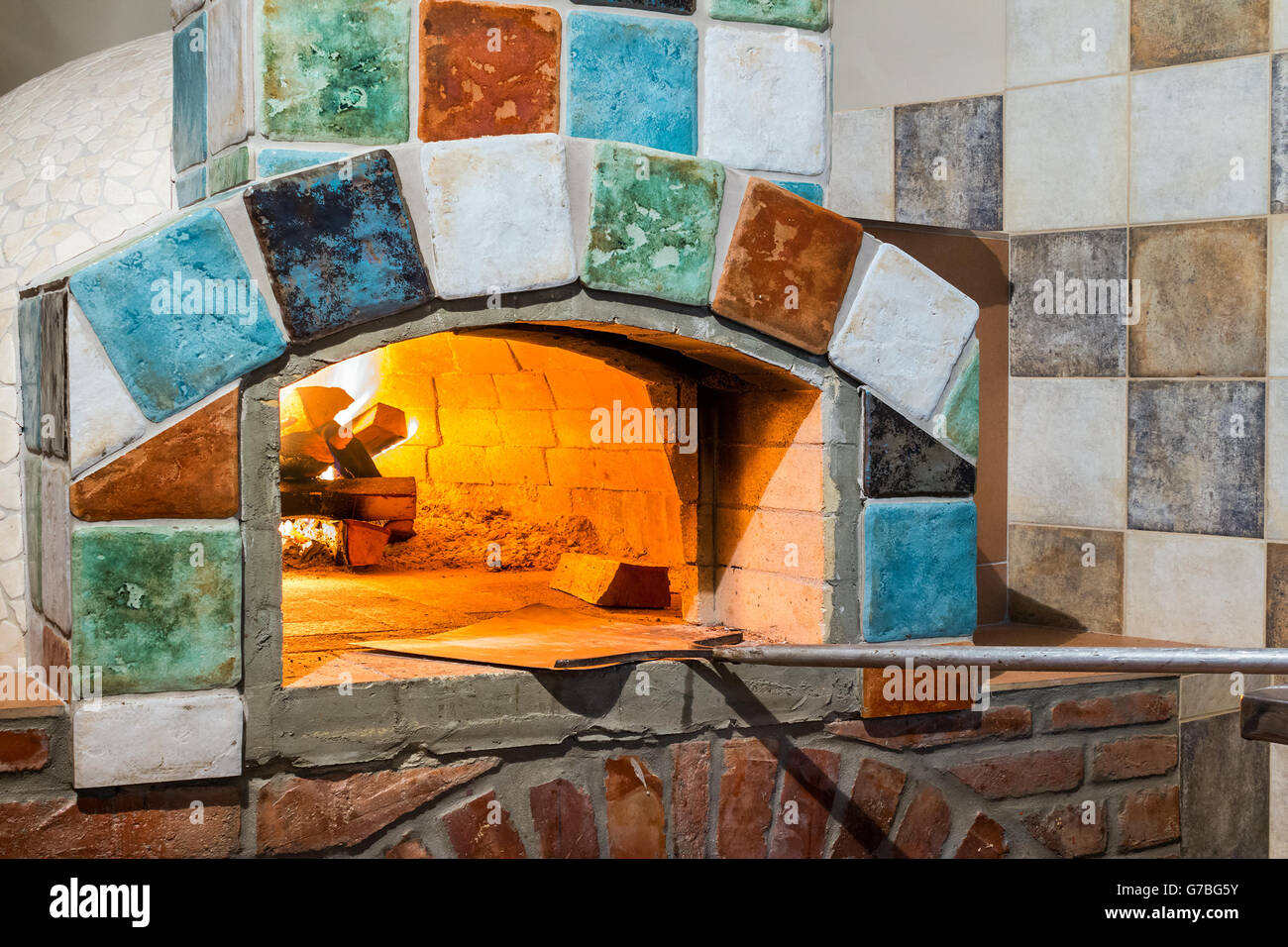 burning fire in professional stonehearth pizza oven with Italian style