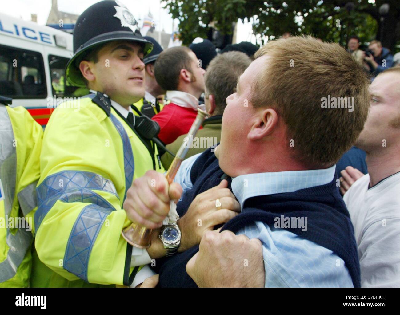 A police officer and a member of the public face to face during a pro-hunting demonstration in Parliament Square, central London, ahead of the vote on a controversial Bill which could finally see fox-hunting and hare-coursing banned in England and Wales. The Hunting Bill will be rushed through the House of Commons in a single day, and the Government has made clear that, if MPs vote for a ban, it will invoke the Parliament Act to quash expected resistance in the Lords. Stock Photo