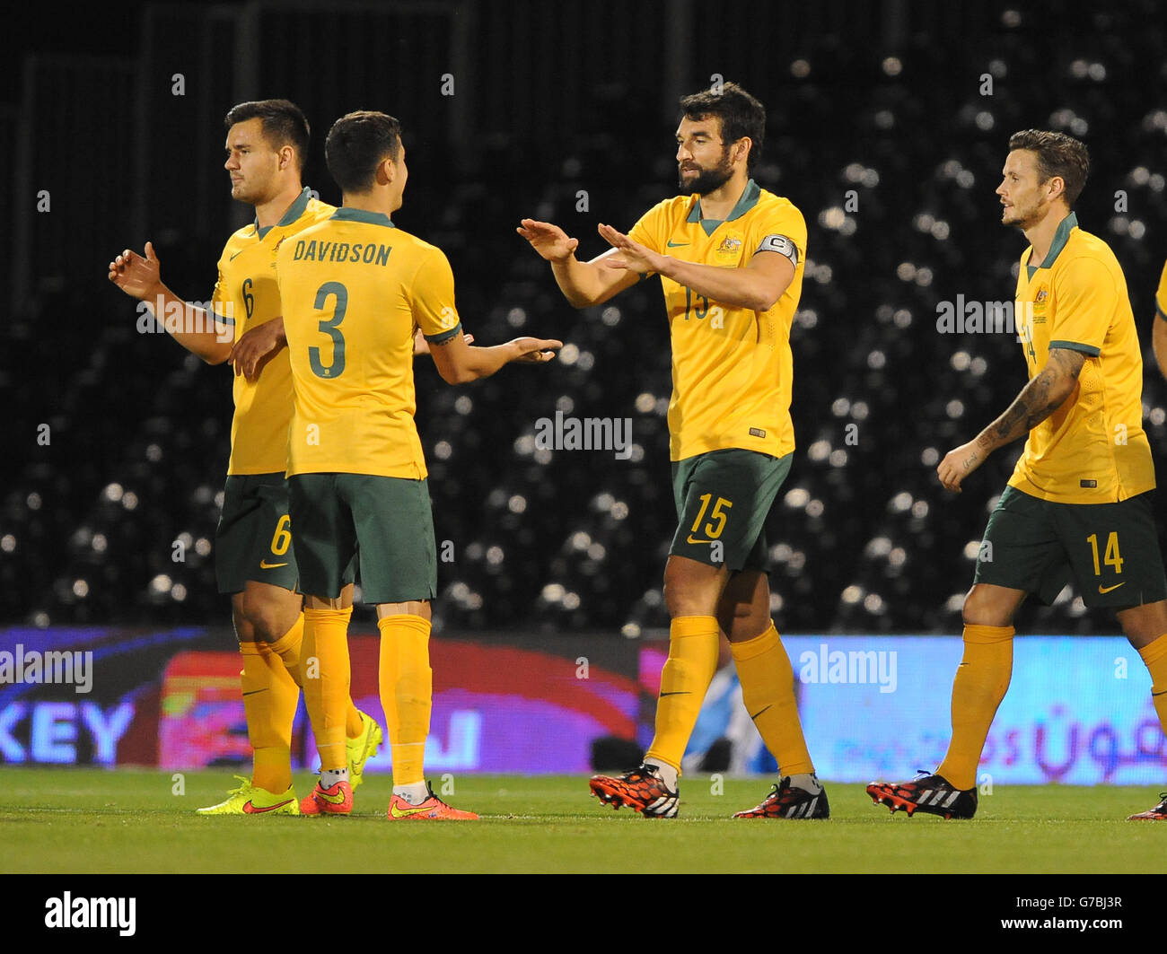 Australia's Mile Jedinak (right) celebrates with Jason Davidson (left) after scoring his sides second goal of the game against Saudi Arabia. Stock Photo