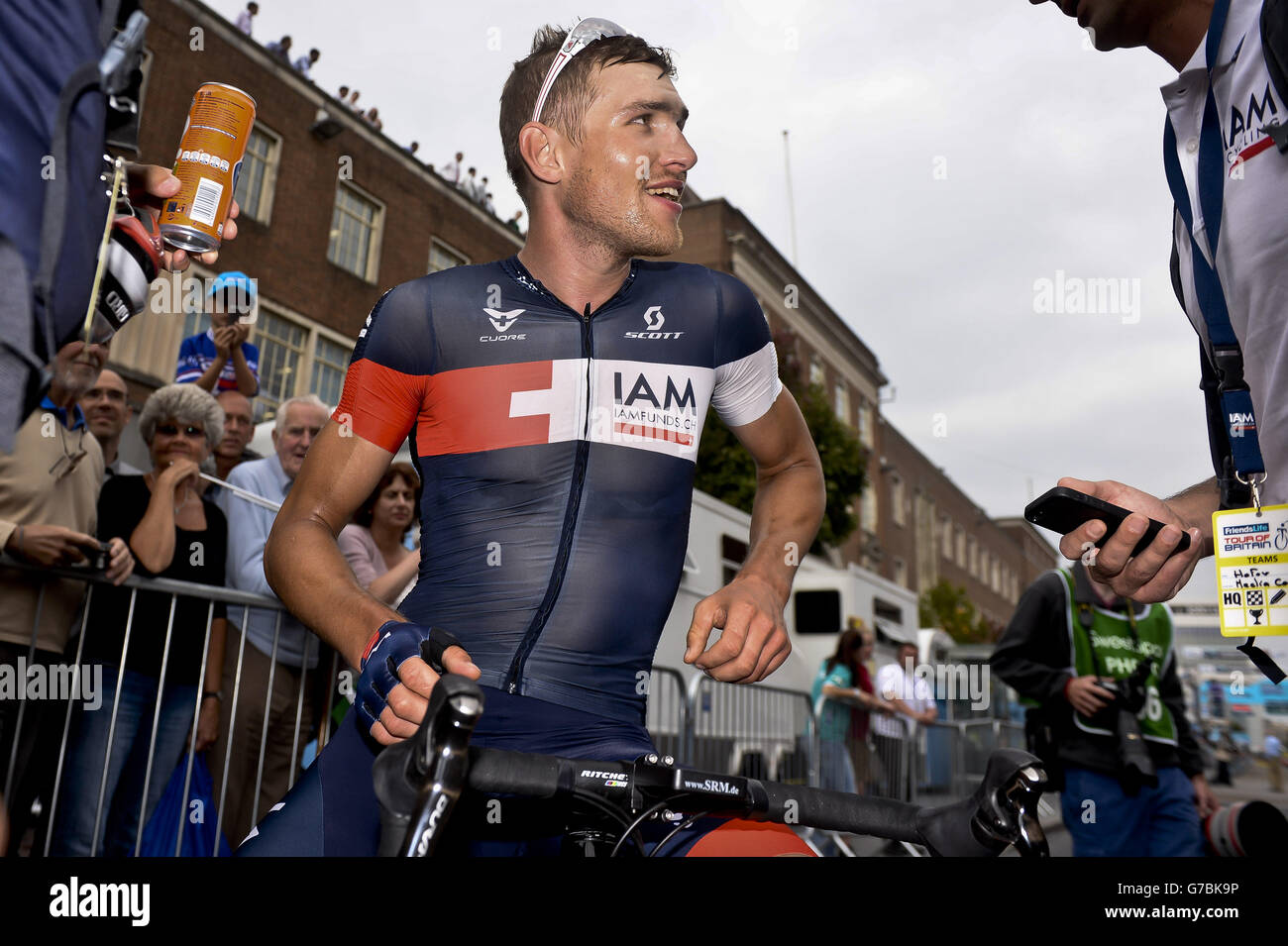 Matthias Brandle of IAM cycling after crossing the finish line in Exeter city centre during the stage five of the 2014 Tour of Britain. Stock Photo