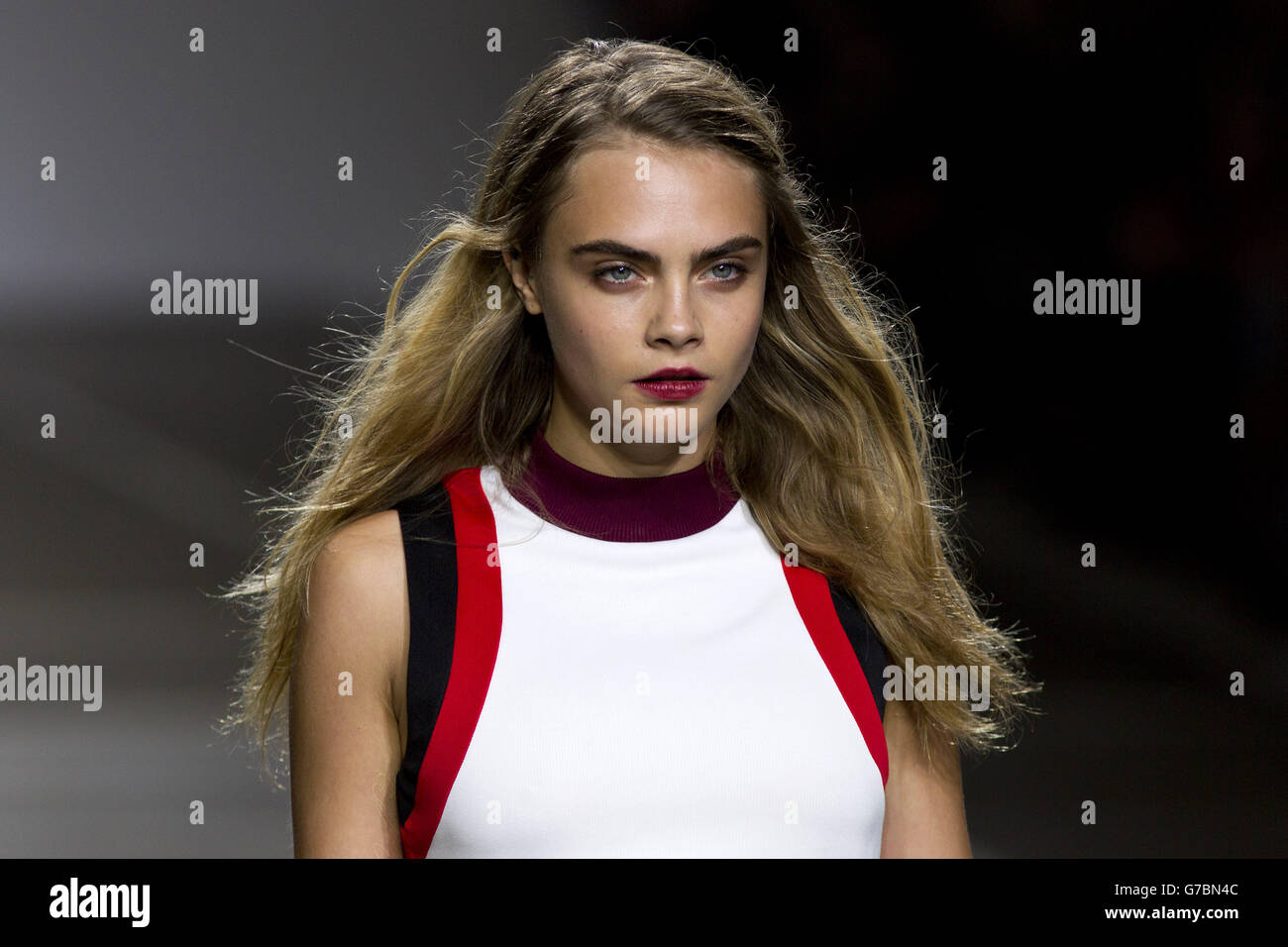 Cara Delevingne in the Topshop catwalk show at the Topshop Show Space in London during London Fashion Week. Stock Photo