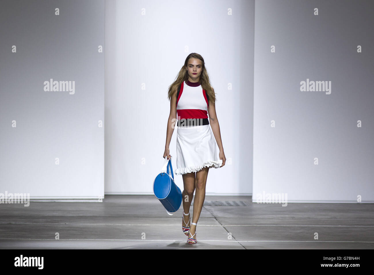 Cara Delevingne in the Topshop catwalk show at the Topshop Show Space in London during London Fashion Week. Stock Photo