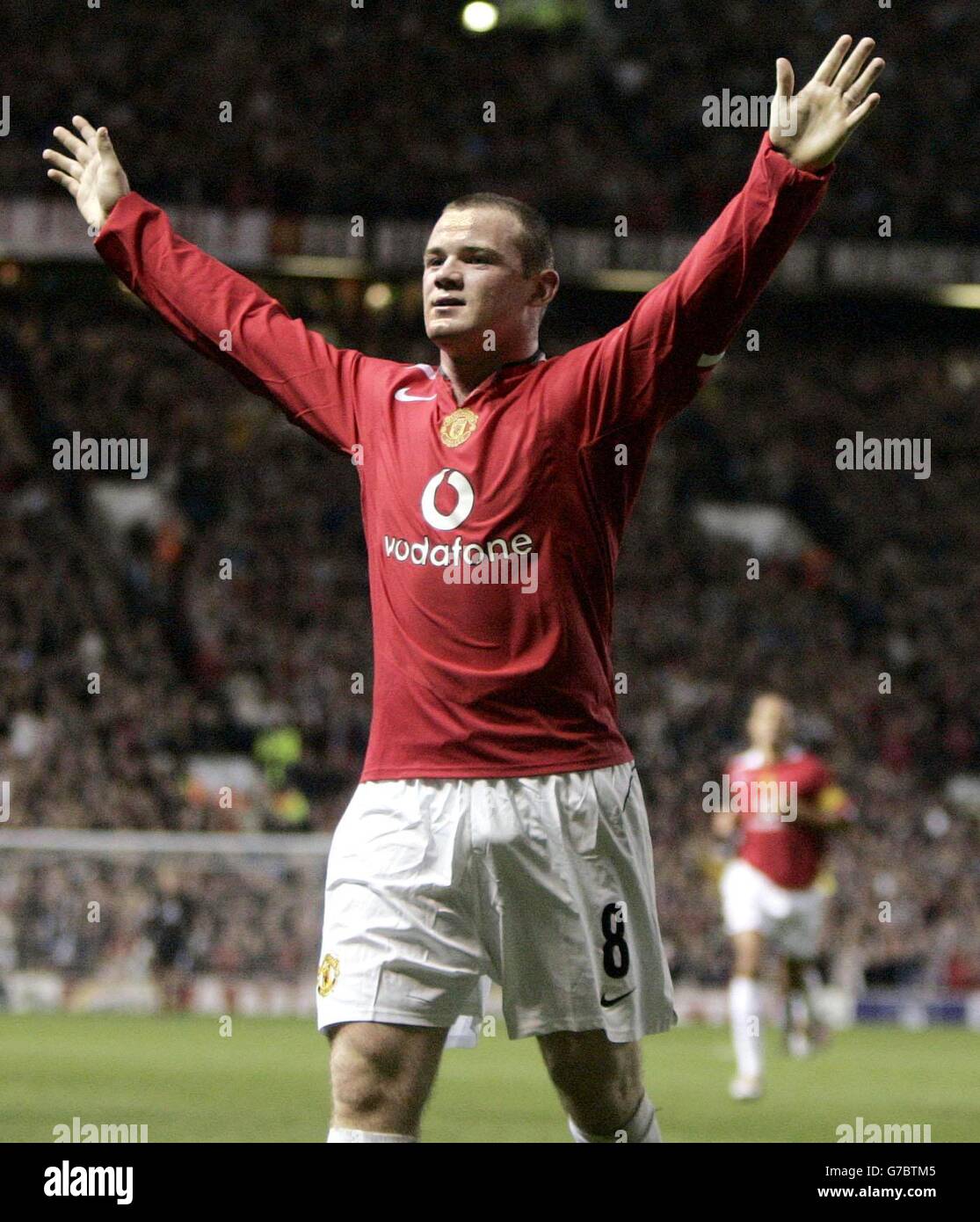 Manchester United debutant Wayne Rooney celebrates after scoring his