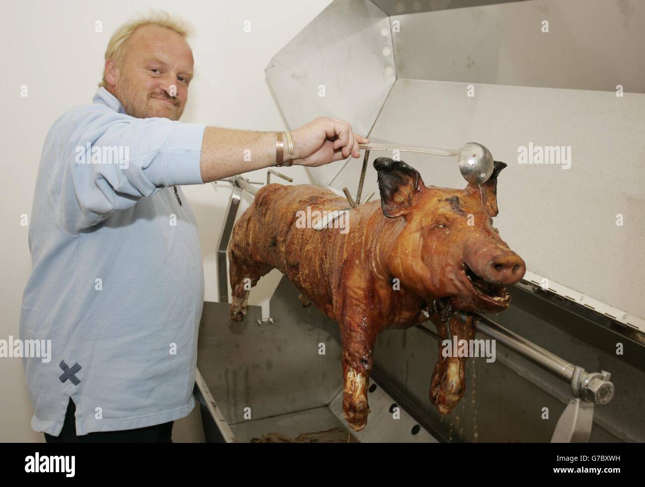 Celebrity chef Anthony Worrall Thompson roasts a pig on a spit at Somerset House in central London, during the 'Taste Of London' four-day extravaganza, which opened its doors to celebrate the best London has to offer in food, drink and entertainment. The event will run until Sunday. Stock Photo