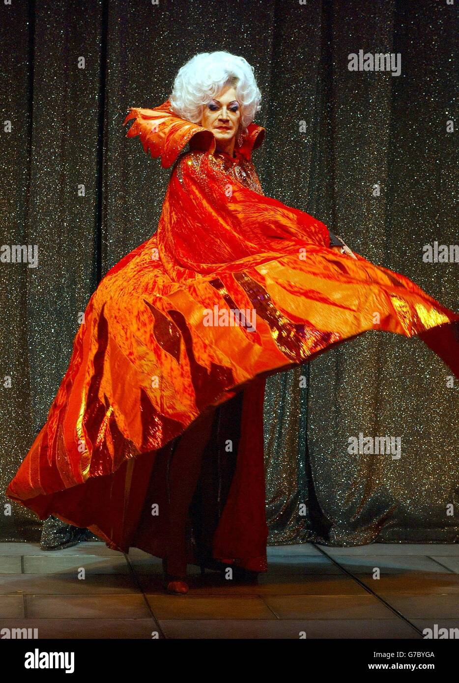 Lily Savage as the Wicked Queen poses for photographers on stage during a photocall for Snow White and the Seven Dwarfs at the Victoria Palace Theatre in London. The family pantomime runs at the theatre for only 50 performances from Friday 17 December to Sunday 23 January 2005. Stock Photo