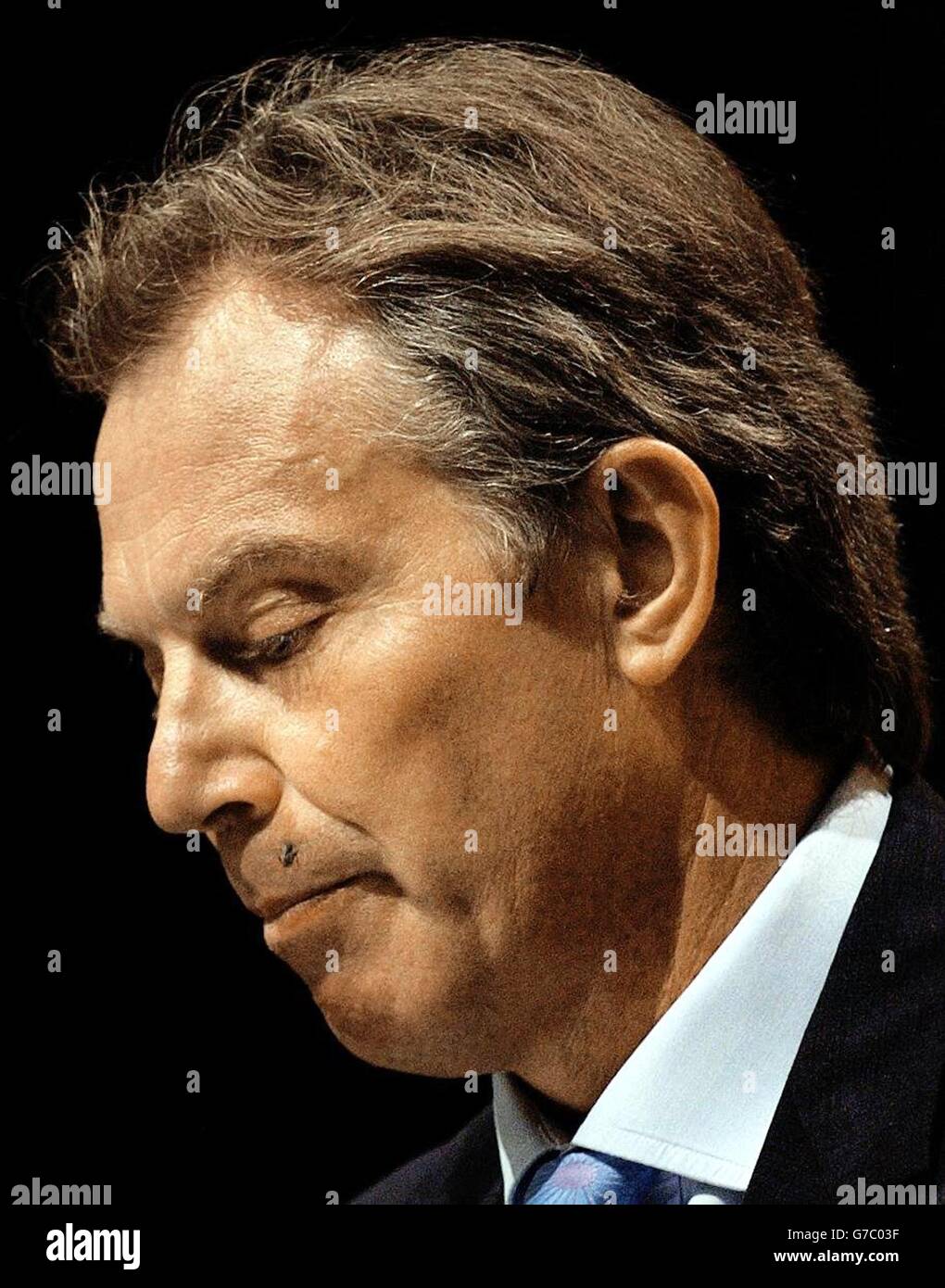 A fly lands on Britain's Prime Minister Tony Blair's lip during his speech to the TUC Conference in Brighton. The Government was today attacked for failing to repeal anti-union laws amid complaints that workers were still waiting for basic rights seven years after Labour came to power. Stock Photo