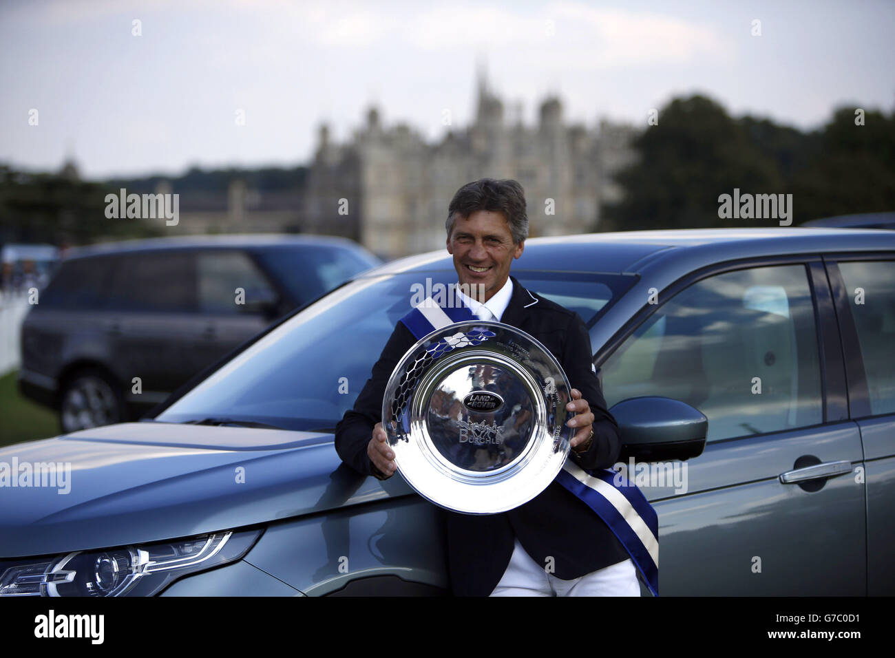 New Zealand's Andrew Nicholson poses with the trophy after winning the 2014 Land Rover Burghley Horse Trials at Burghley Park, Stamford. Stock Photo