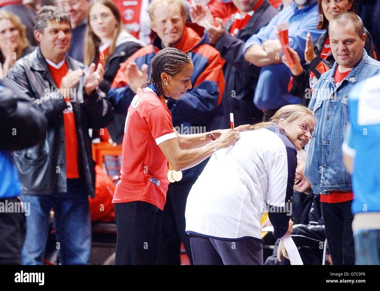 Double Olympic Gold Medal Winner Kelly Holmes Signs An Autograph At The double-olympic-gold-medal-winner-kelly-holmes-signs-an-autograph-at-the