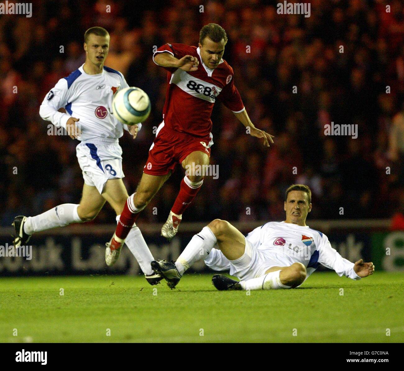 Middlesbrough Szilard Nemeth (centre) is tackled by Peter Drozd of Banik Ostrava during the UEFA Cup First Round, First Leg, tie at the Riverside Stadium, Middlesbrough. NO WEBSITE/INTERNET USE UNLESS SITE IS REGISTERED WITH FOOTBALL ASSOCIATION PREMIER LEAGUE Stock Photo