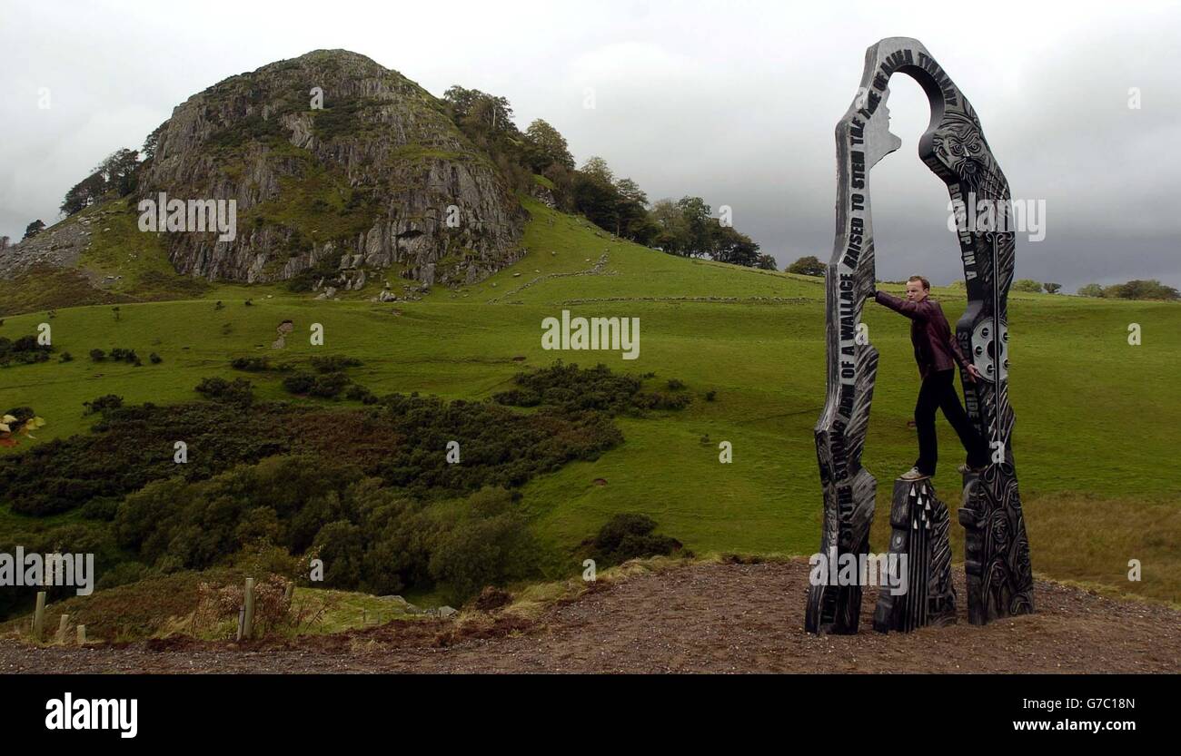 Sculptor Richard Price with the 'Spirit of Scotland' sculpture on the Wallace Trail in the shadow of Loudoun Hill near Darvel. Stock Photo