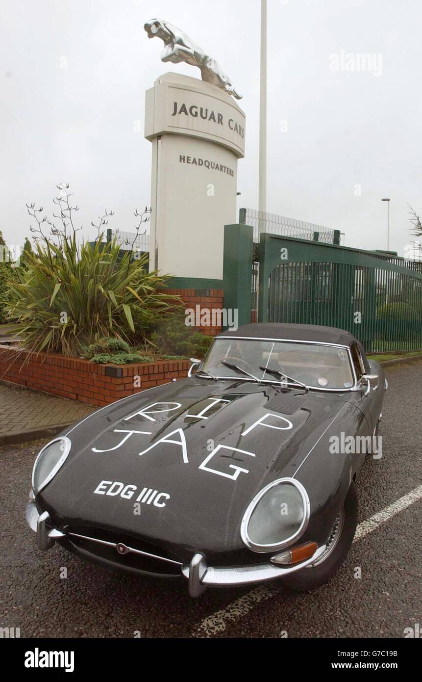 Andrew Longfield uses his 1965 E Type Jaguar as a one man protest against the closure of the Browns Lane plant at Coventry. Production of Jaguar cars is to end at its Browns Lane site in Coventry, with the loss of more than 1,100 jobs, the company announced today. Around 750 white collar workers and 400 production staff will lose their jobs at the Browns Lane site in Coventry, but Ford, which owns the company, said there will be no compulsory redundancies. Stock Photo