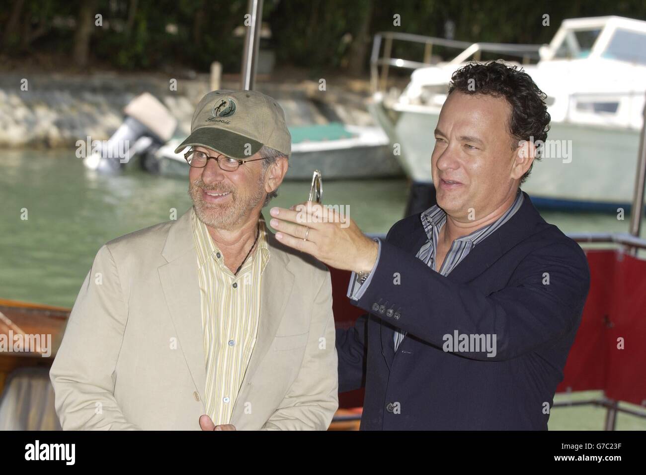 US actor Tom Hanks (right) and director Steven Spielberg arrive at the Lido in Venice to promote their new film Terminal during the 61st International Venice Film Festival. Stock Photo