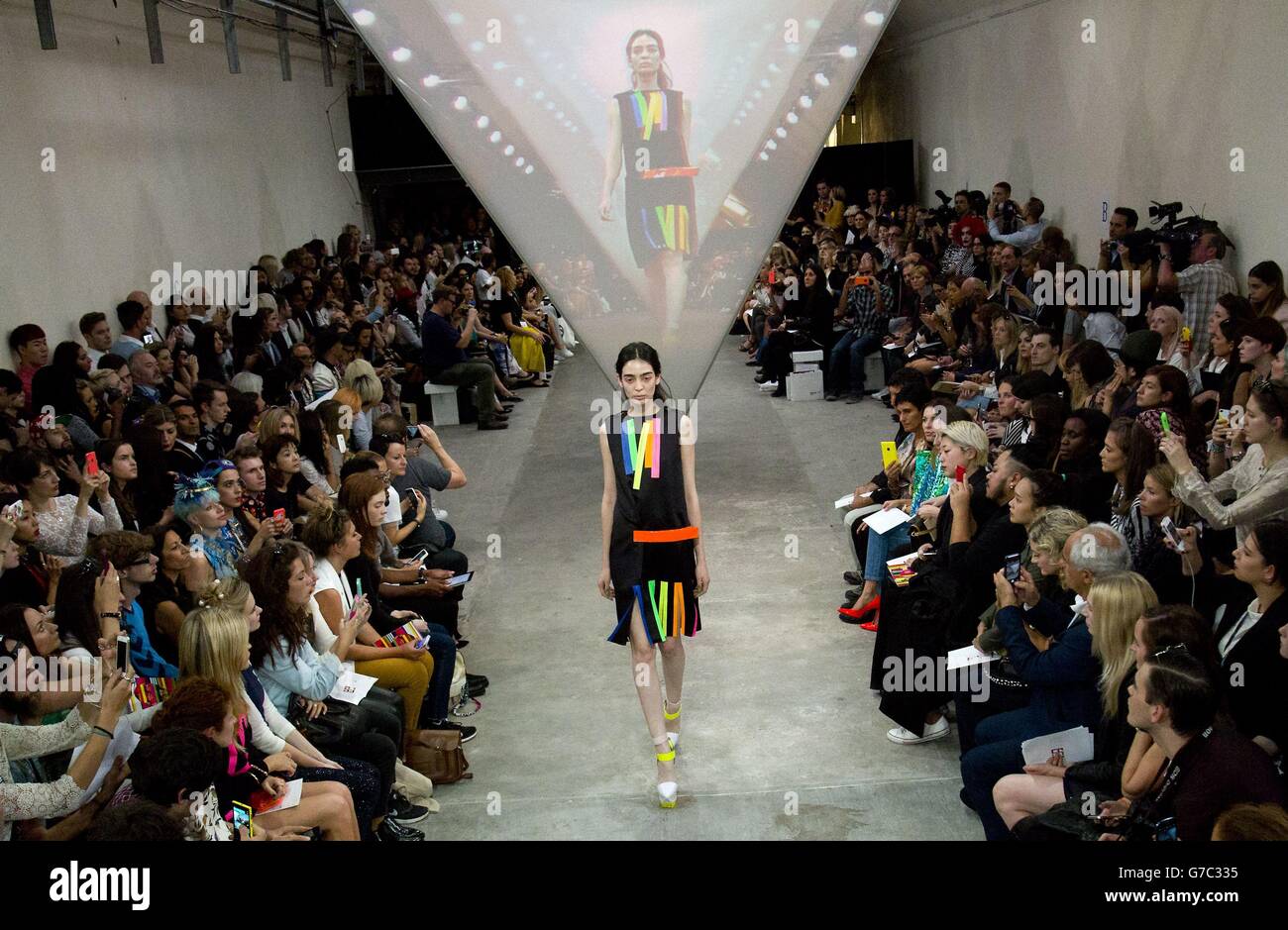 A model on the catwalk during the Fyodor Golan catwalk show in London during London Fashion Week. Stock Photo