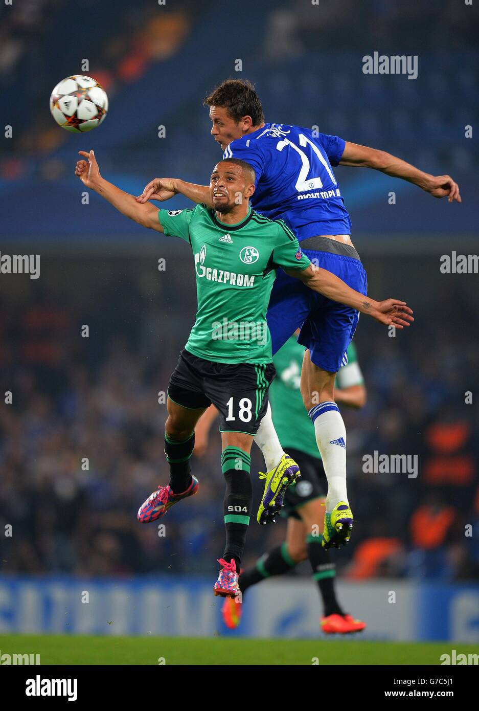Chelsea's Nemenja Matic (right) wins the ball in the air from FC Schalke's Sidney Sam during the UEFA Champions League, Group G match at Stamford Bridge, Liverpool. Stock Photo