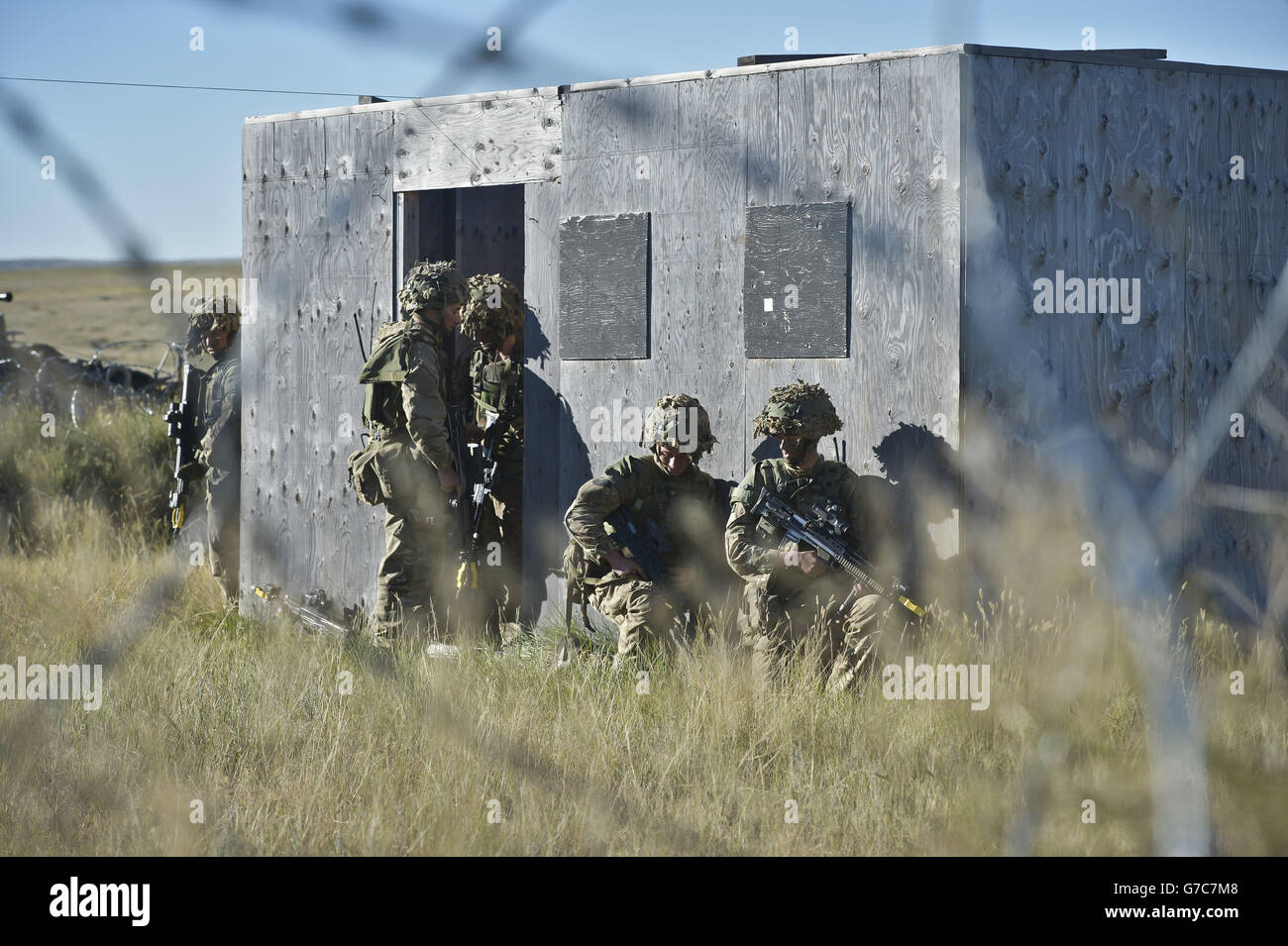 Previously unreleased picture dated 21/09/14 of soldiers preparing to breach a building as thousands of soldiers have begun the world's biggest game of laser quest as they take part in exercise Prarie Storm at the British Army Training Unit Suffield (BATUS) in Calgary, Canada. Stock Photo