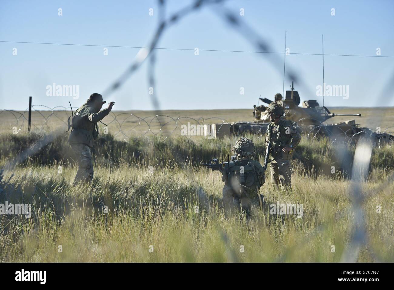 Previously unreleased picture dated 21/09/14 of soldiers capturing a simulated prisoner of war as thousands of soldiers have begun the world's biggest game of laser quest as they take part in exercise Prarie Storm at the British Army Training Unit Suffield (BATUS) in Suffield, Canada. Stock Photo