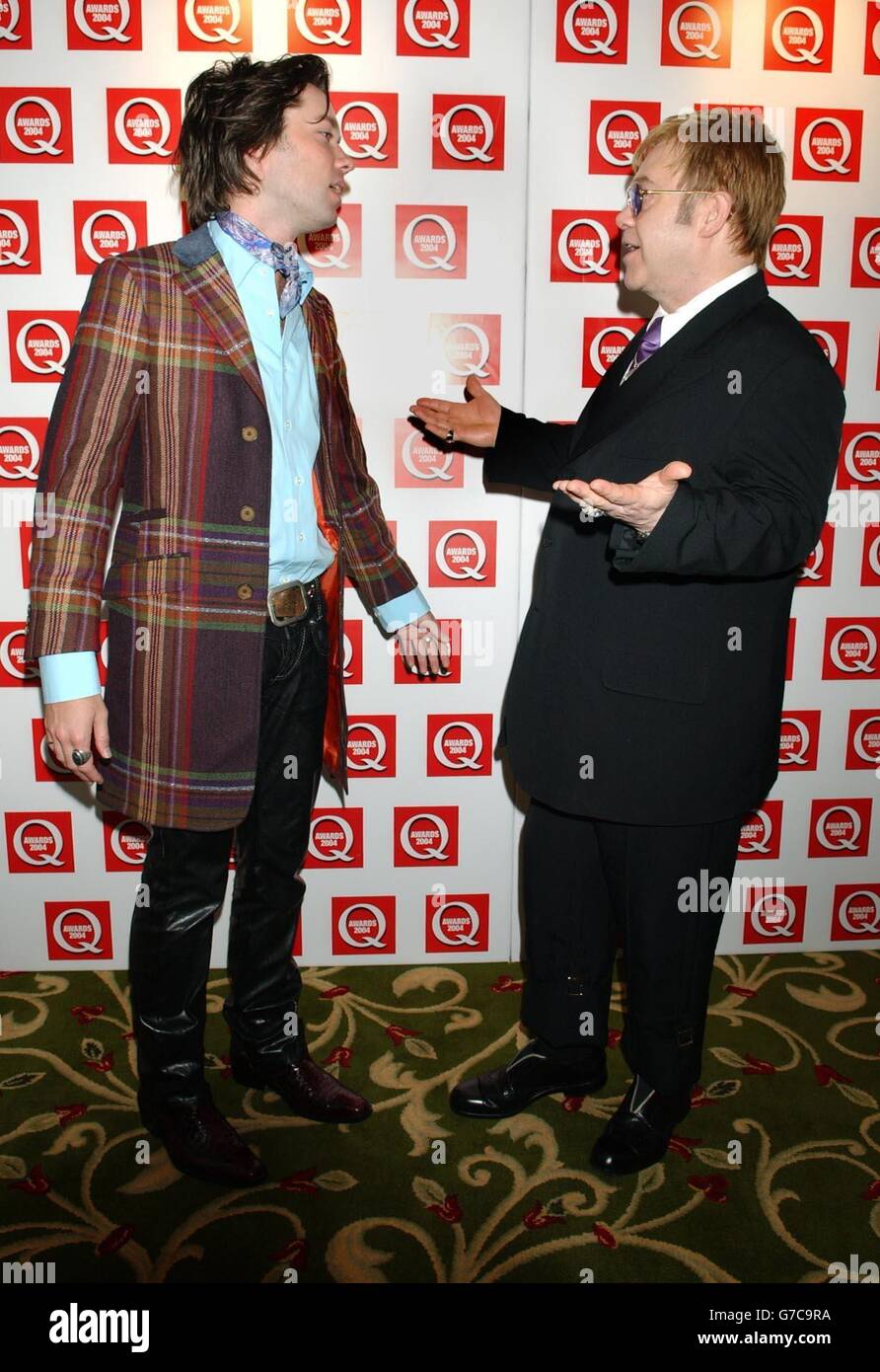 Singer Sir Elton John (right) with Rufus Wainwright - who collaborated with Elton on his album ' Songs From The West Coast' - during the 16th annual Q Awards at Grosvenor House in London's Park Lane. Jonathan Ross hosts the music magazine awards honouring the best in the industry. Stock Photo