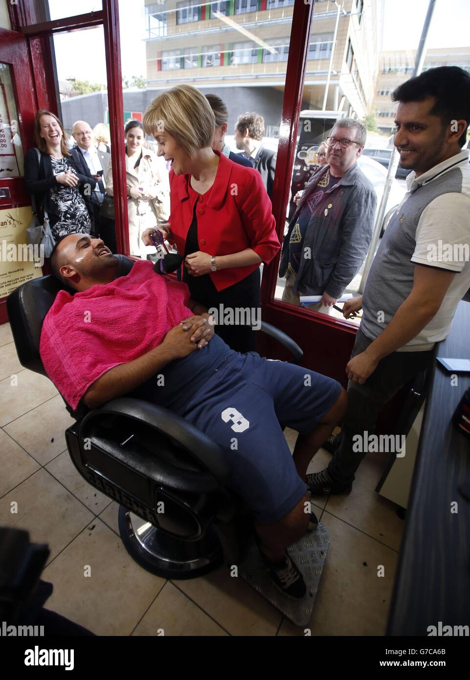 Deputy First Minister of Scotland Nicola Sturgeon visits Shwan's Turkish Barbers in Glasgow while, campaign to say that a Yes vote is the only way to secure the status and funding of Scotland's NHS, as the campaign ahead of the Scottish independence referendum continues. Stock Photo