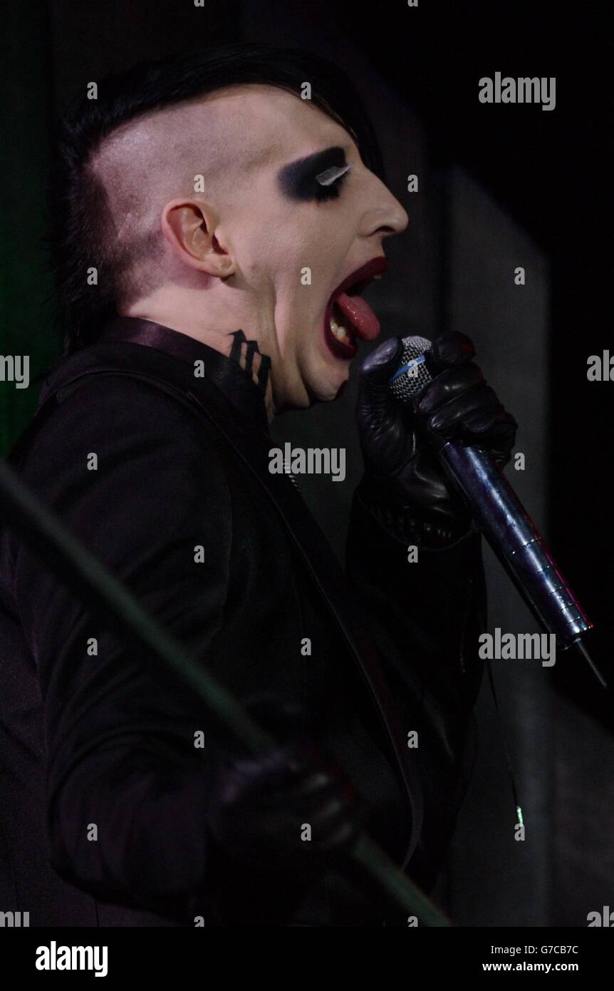 American rock singer Marilyn Manson on stage during the 'MTV Icon of 2004' tribute to 1980s goth rock band The Cure - the event honouring their significant contribution to music, music video and pop culture after a 25 year career - held at the Old Billingsgate Market in London. Stock Photo