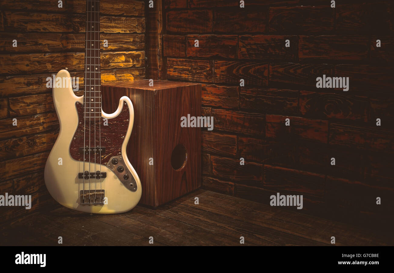 Cajon and Bass guitar on small stage in pub Stock Photo