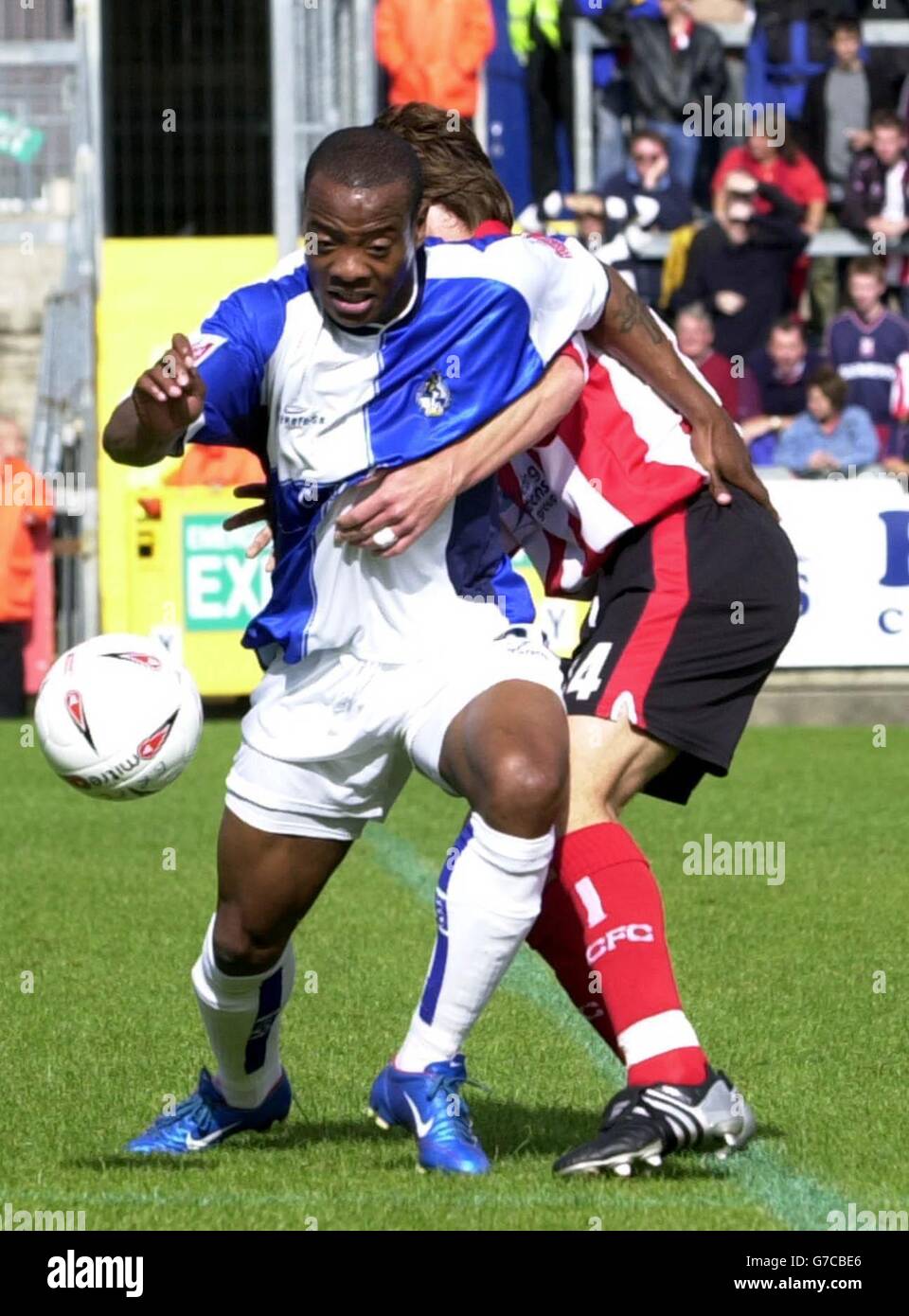 Bristol Rovers' Junior Agogo goes past Lincoln City's Ben Futcher during the Coca Cola League One match at the Memorial Ground, Bristol, Saturday September 18, 2004. NO UNOFFICIAL CLUB WEBSITE USE. Stock Photo