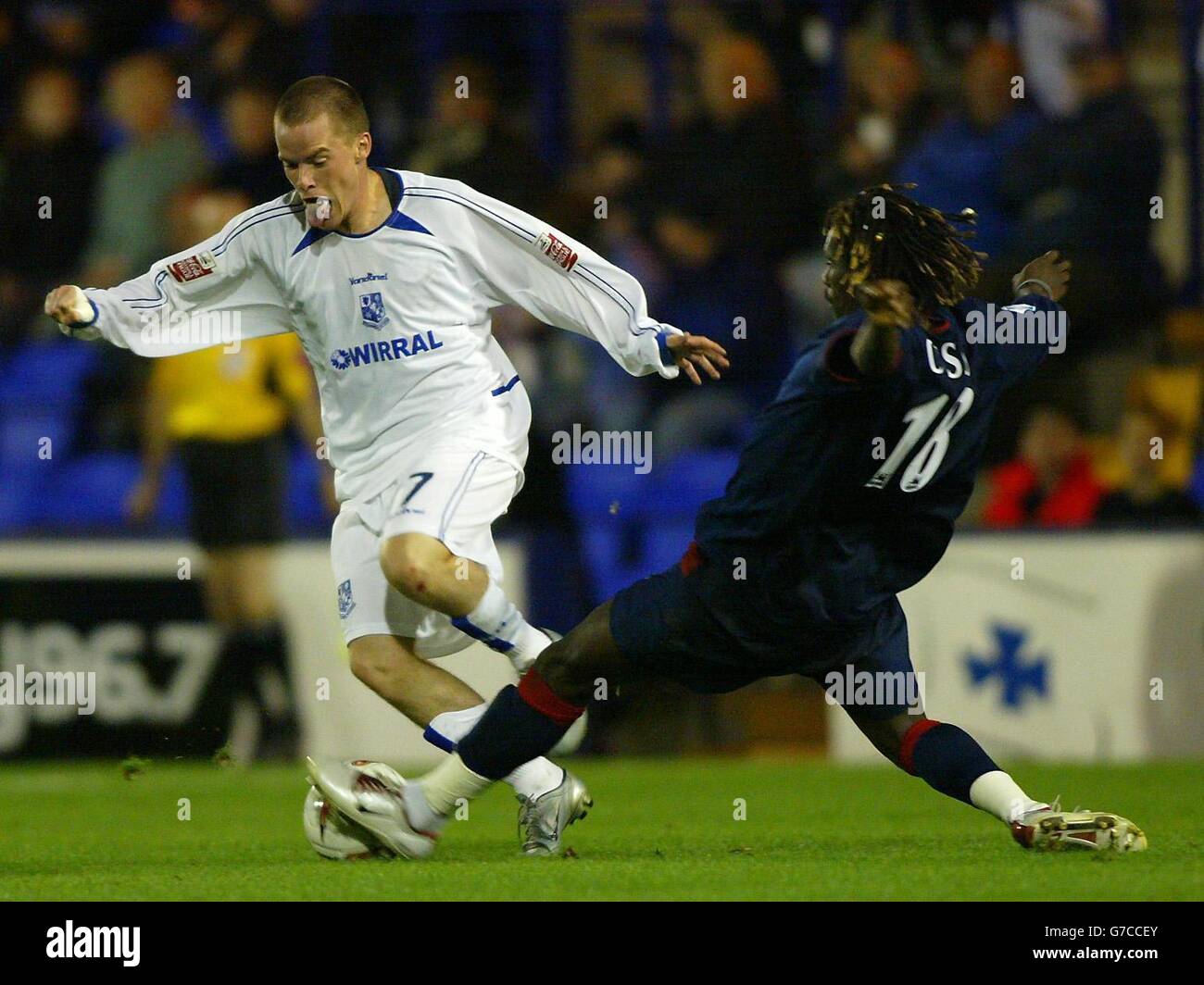 Tranmere Rovers' Iain Hume (left) battles with Portsmouth's Aliou Cisse during their Carling Cup second round match at Prenton Park, Birkenhead. Stock Photo
