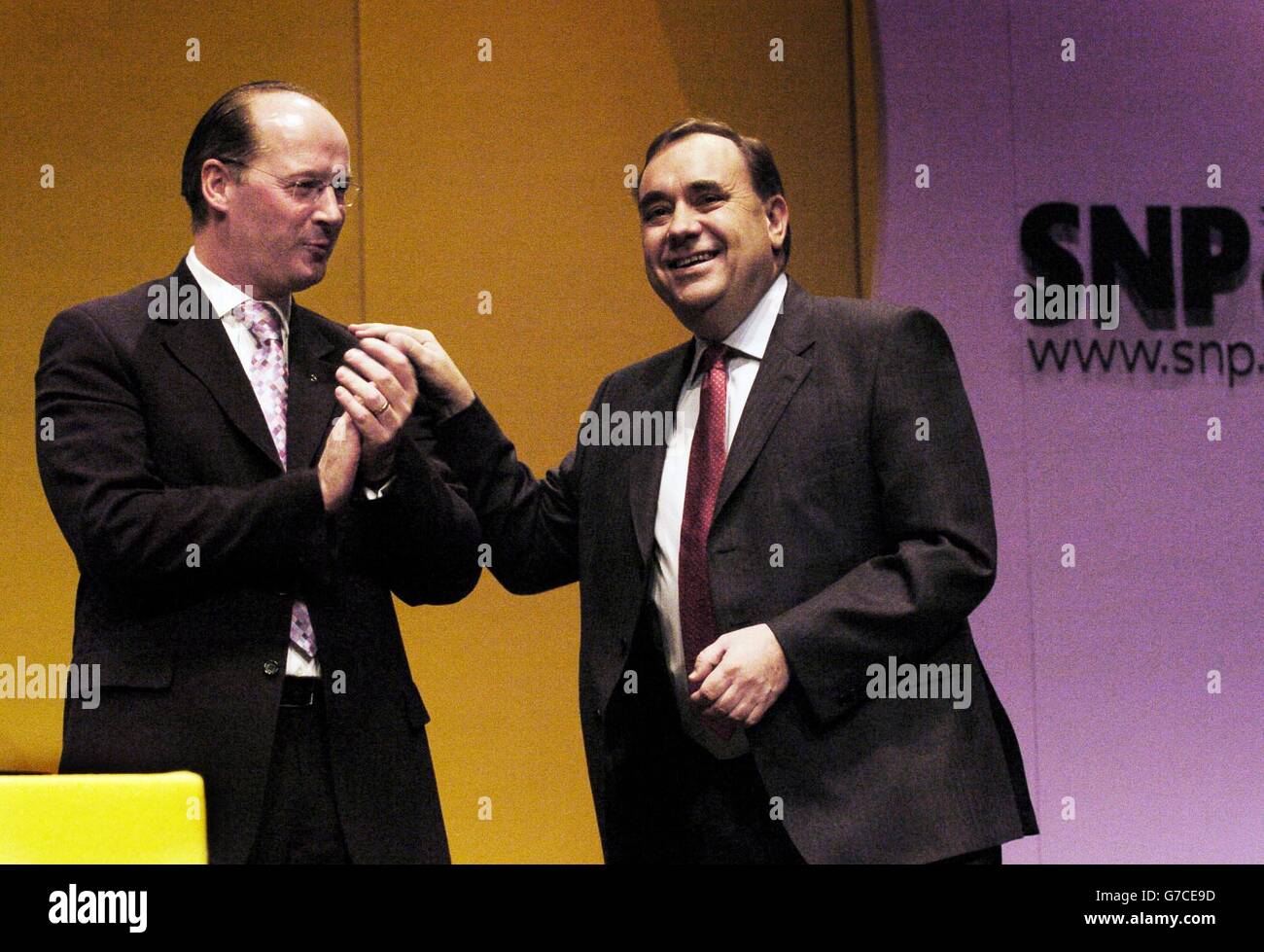 Alex Salmond (right) leader of the Scottish National Party celebrates after his speech with John Swinney at the SNP Conference in Inverness. Stock Photo