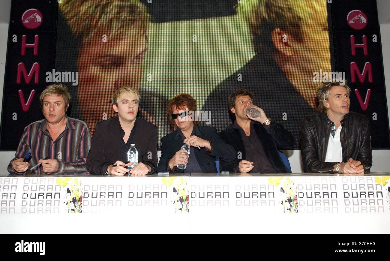 Pop group Duran Duran during an in-store appearance at HMV Oxford Street in  central London, to meet fans and sign copies of their latest single '(Reach  Up For The) Sunrise' Stock Photo -