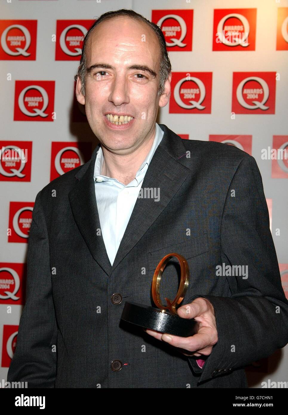 Former Clash member Mick Jones with his Best Producer Award for his