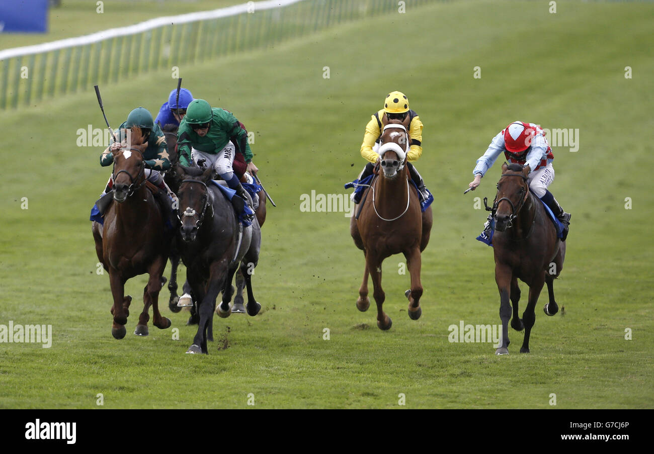 Nabucco ridden by William Buick (green cap) battles with Ayrad (left) ridden by Andrea Atzeni in the Mawatheeq Godolphin Stakes during day two of The Cambridgeshire Meeting at Newmarket Racecourse, Newmarket. Stock Photo