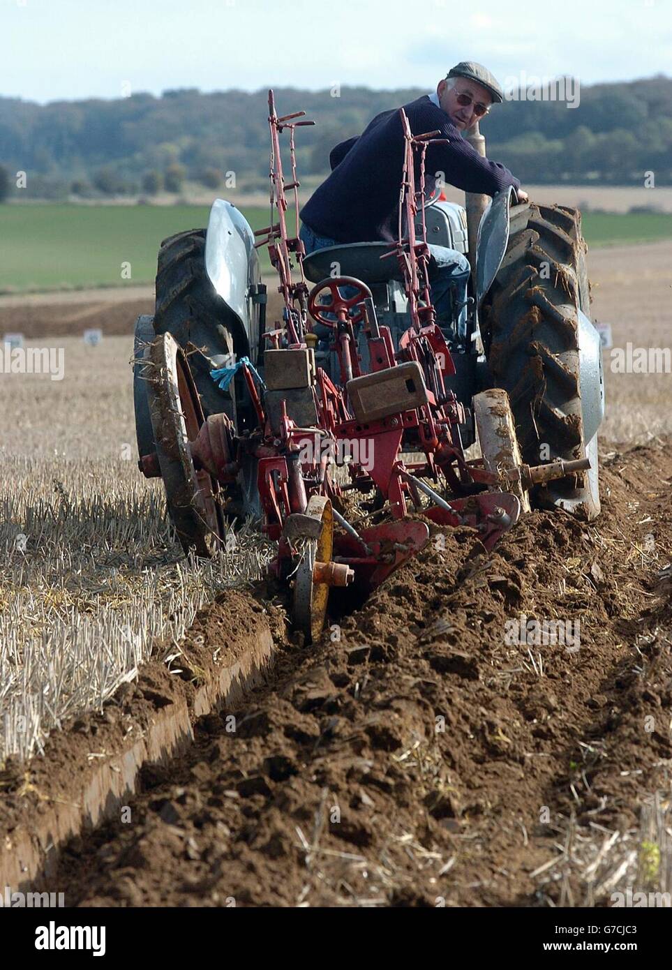 Richard Curtis from Brigwater, Somerset, trys to keep a straight line at the 54th British National Ploughing Championships in Reading, Berkshire. Stock Photo