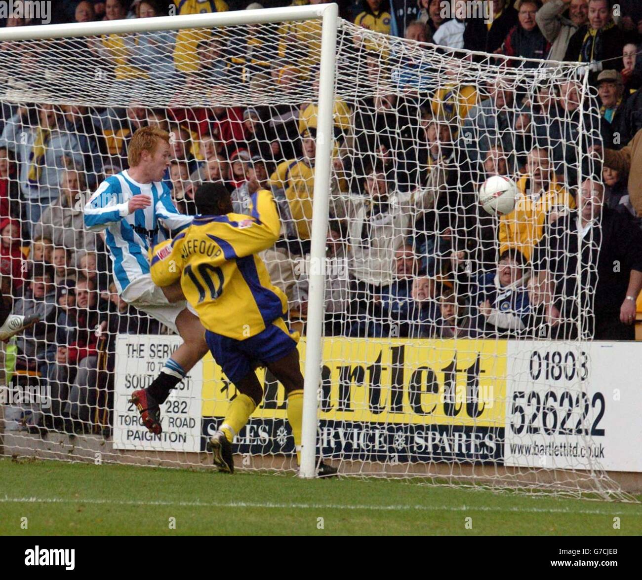 Torquay's Jonathan Kuffour scores the winning goal against Huddersfield during their Coca Cola League One match at Plainmoor, Torquay. NO UNOFFICIAL CLUB WEBSITE USE. Stock Photo