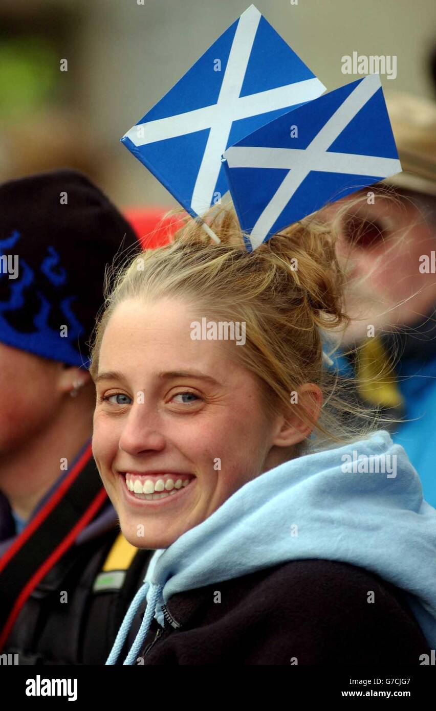 Some of the crowd at the Scottish Parliament gathered at the ceremony to mark it's official opening. Stock Photo