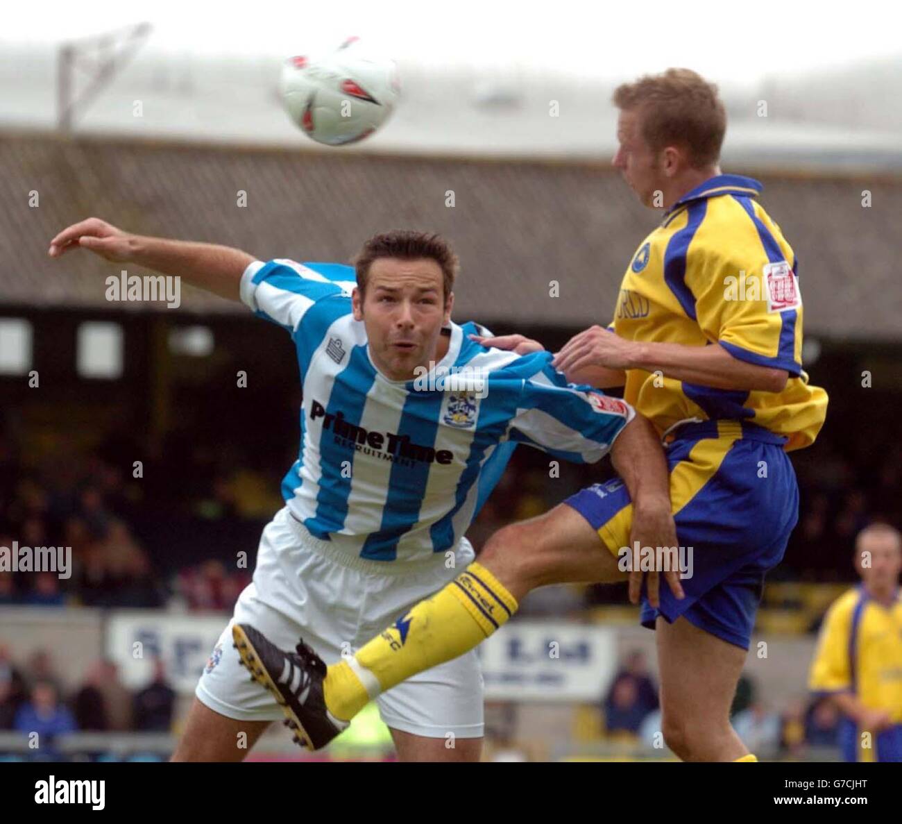 Huddersfield Town's Pawal Abbott contest with Torquay United's Alex Russell, during their Coca Cola League One match at Plainmoor, Torquay. NO UNOFFICIAL CLUB WEBSITE USE. Stock Photo