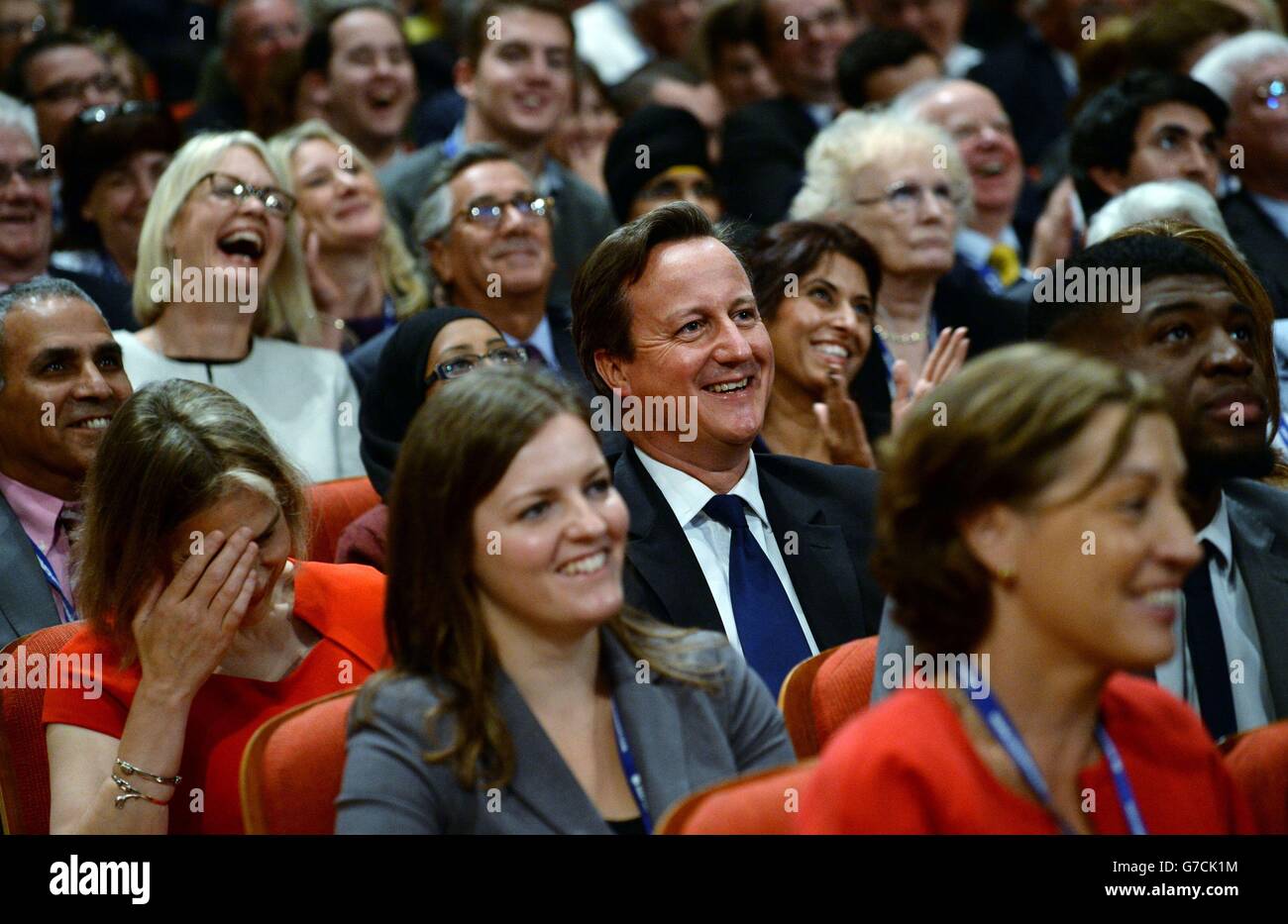 Prime Minister David Cameron watches Mayor of London Boris making his speech to delegates at the Conservative Party annual conference in the International Convention Centre, Birmingham. Stock Photo