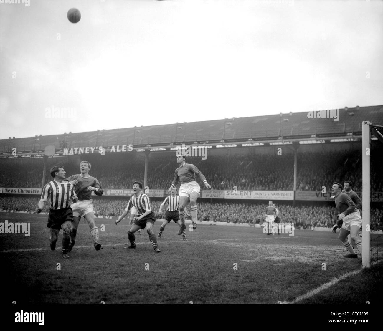 The exultation of the chase grips Southampton attackers (stripes) as, harried by defenders, they raid the Leyton Orient goal during the fourth roudn FA Cup tie at The Dell. Left to Right: O'Brien, Lea, Mulgrew, Derek Reeves, Bishop (jumping). Orient won the match 2-0. Stock Photo