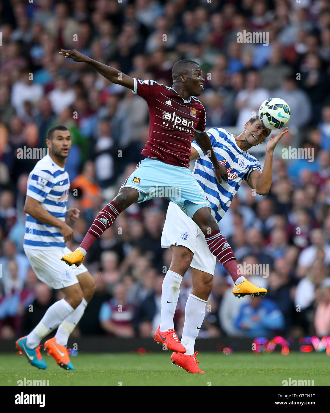 West Ham United S Diafra Sakho Left And Queens Park Rangers Rio Ferdinand Right Battle For The Ball In The Air During The Barclays Premier League Match At Upton Park London Stock Photo