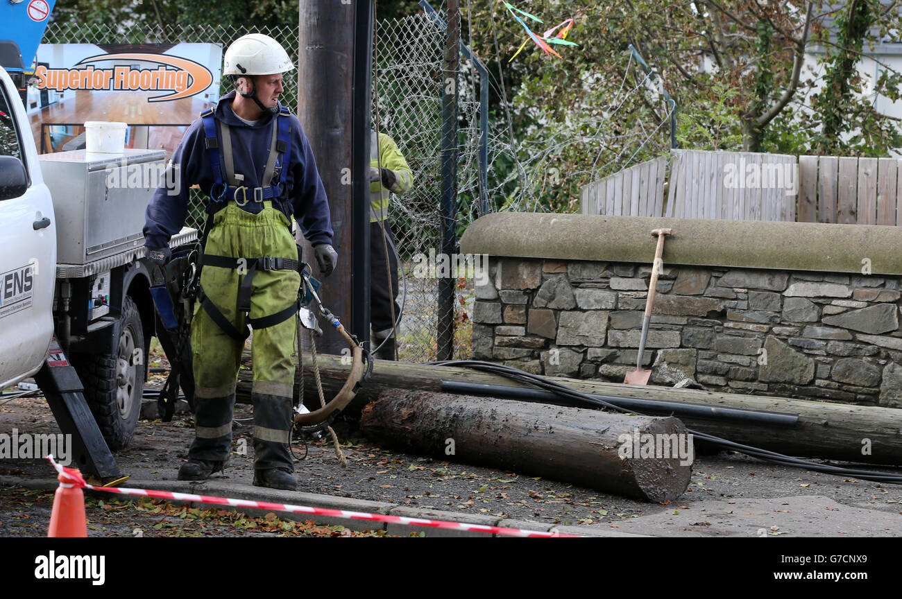 A repair worker from Northern Ireland Electricity works to restore