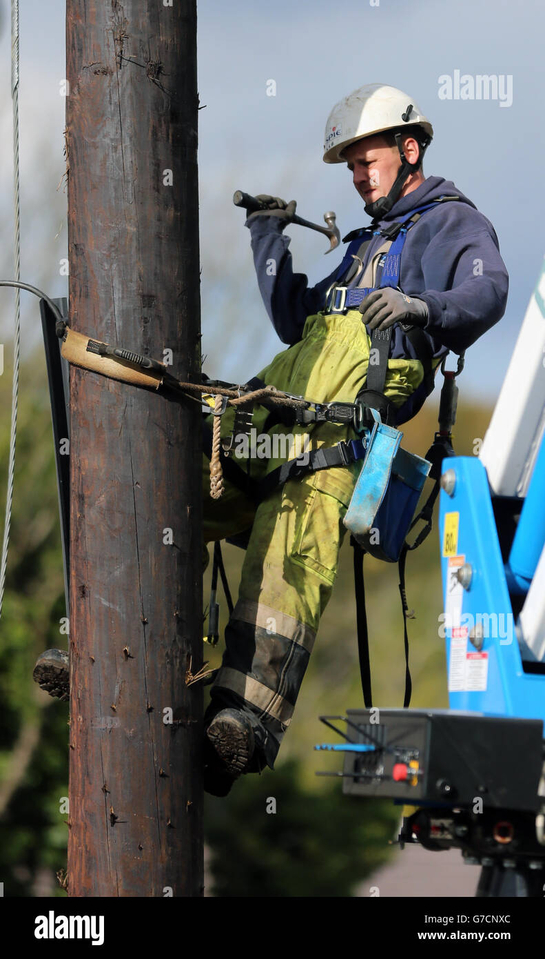 A repair worker from Northern Ireland Electricity works to restore