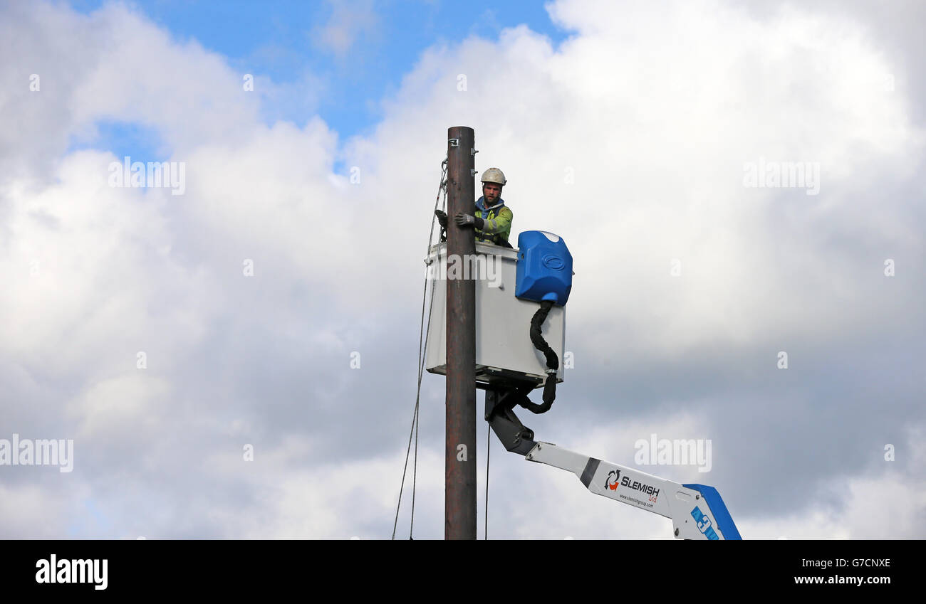A repair worker from Northern Ireland Electricity works to restore