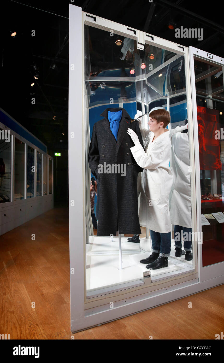 Conservator Melina Plottu prepares a Belstaff coat worn by Benedict  Cumberbatch in the popular Sherlock television series, ahead of the opening  of the Sherlock Holmes exhibition, which opens to the public on