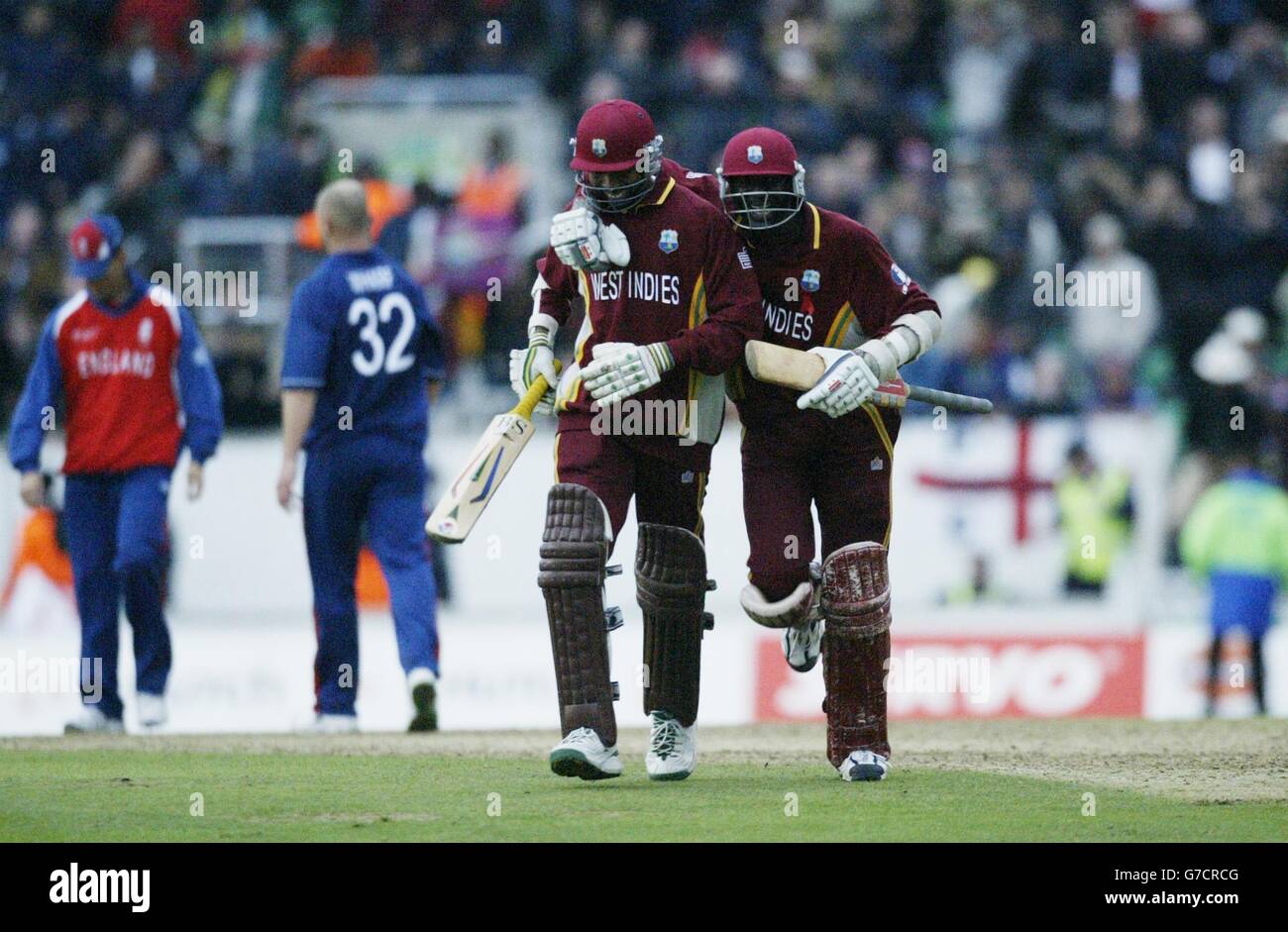 West Indies batsman Ian Bradshaw (left) and Courtney Browne celebrate their two wicket win against England in the ICC Champions Trophy final at the Oval, London, Saturday September 25, 2004. EDITORIAL USE ONLY. NO MOBILE PHONE USE. Stock Photo
