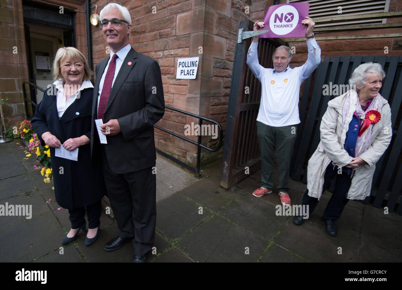 Former chancellor and leader of the Better Together campaign Alistair Darling with No campaigners outside the polling station at the Church Hill Theatre in Edinburgh as polls have opened on a historic day for Scotland as voters determine whether the country should remain part of the United Kingdom. Stock Photo