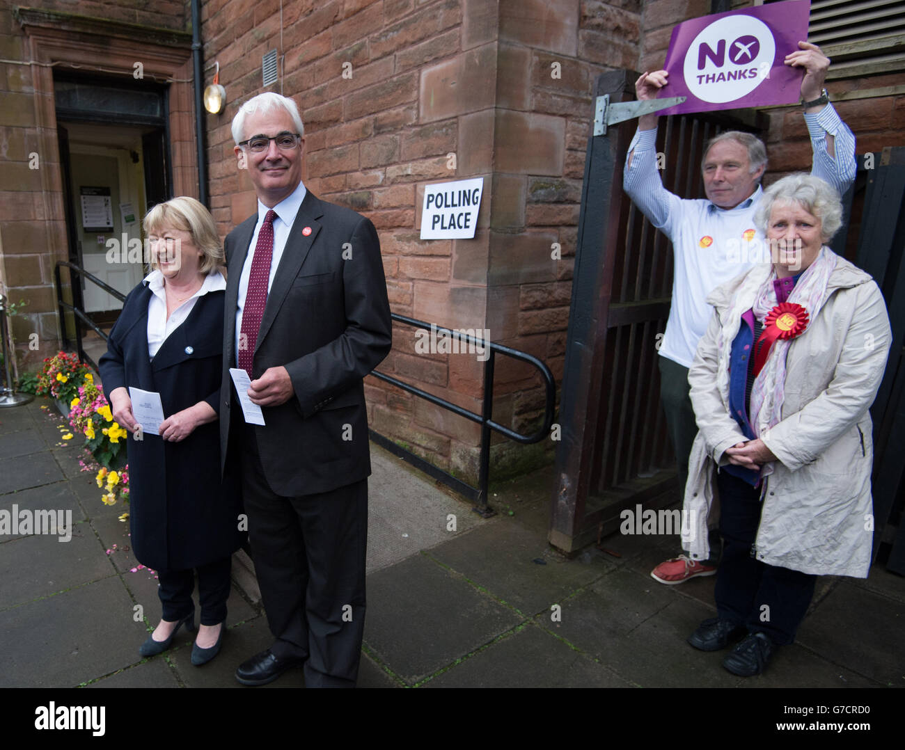 Former chancellor and leader of the Better Together campaign Alistair Darling with his wife Maggie (left) and No campaigners outside the polling station at the Church Hill Theatre in Edinburgh as polls have opened on a historic day for Scotland as voters determine whether the country should remain part of the United Kingdom. Stock Photo