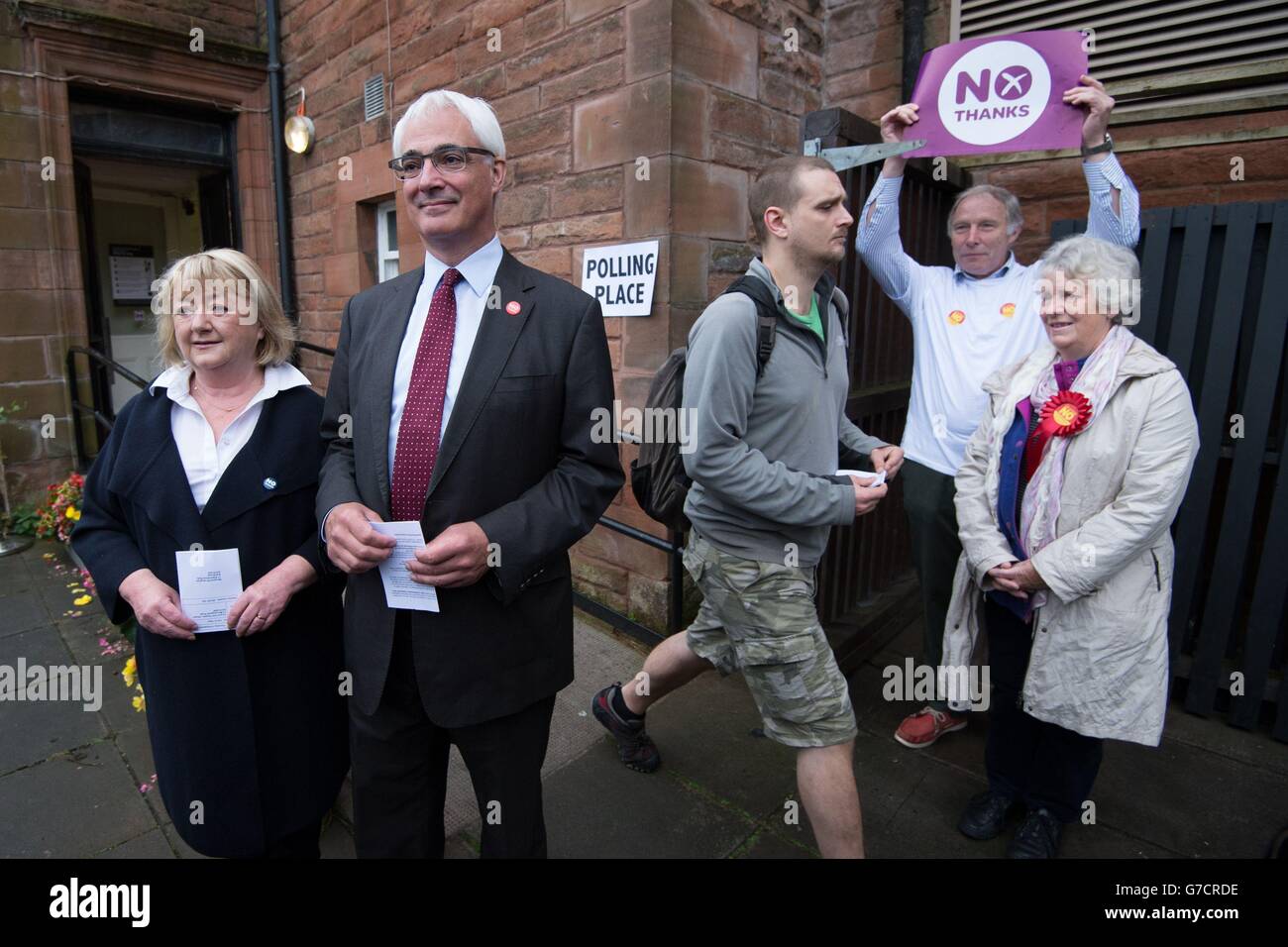Former chancellor and leader of the Better Together campaign Alistair Darling with his wife Maggie (left) and No campaigners outside the polling station at the Church Hill Theatre in Edinburgh as polls have opened on a historic day for Scotland as voters determine whether the country should remain part of the United Kingdom. Stock Photo