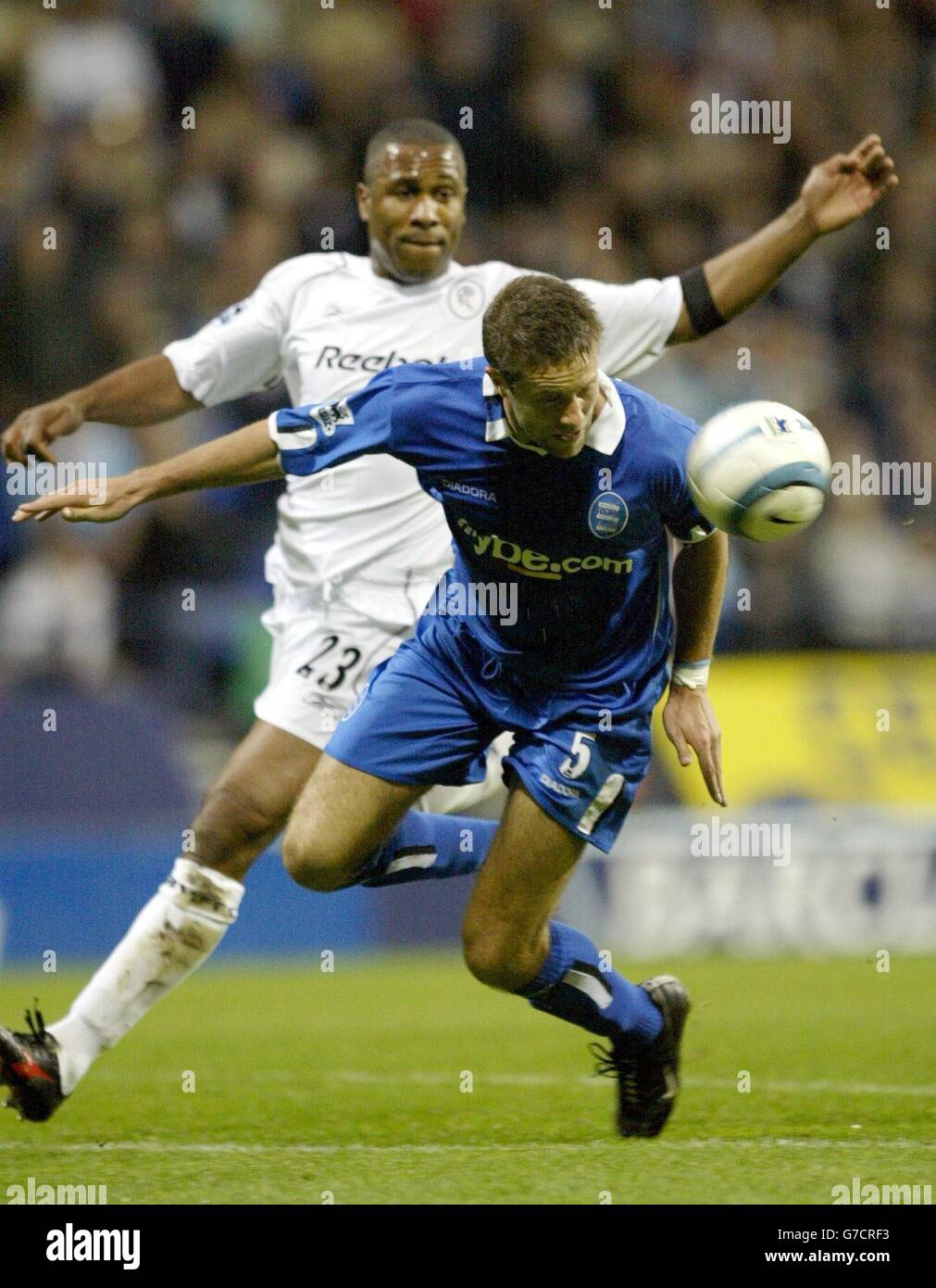 Birmingham City's Matthew Upson beats Les Ferdinand of Bolton Wanderers ...